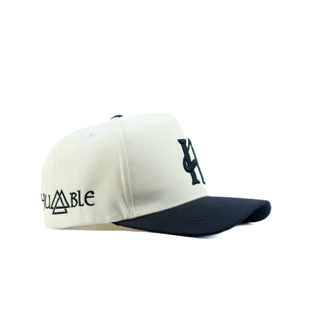 White and black cap with logo on a white background