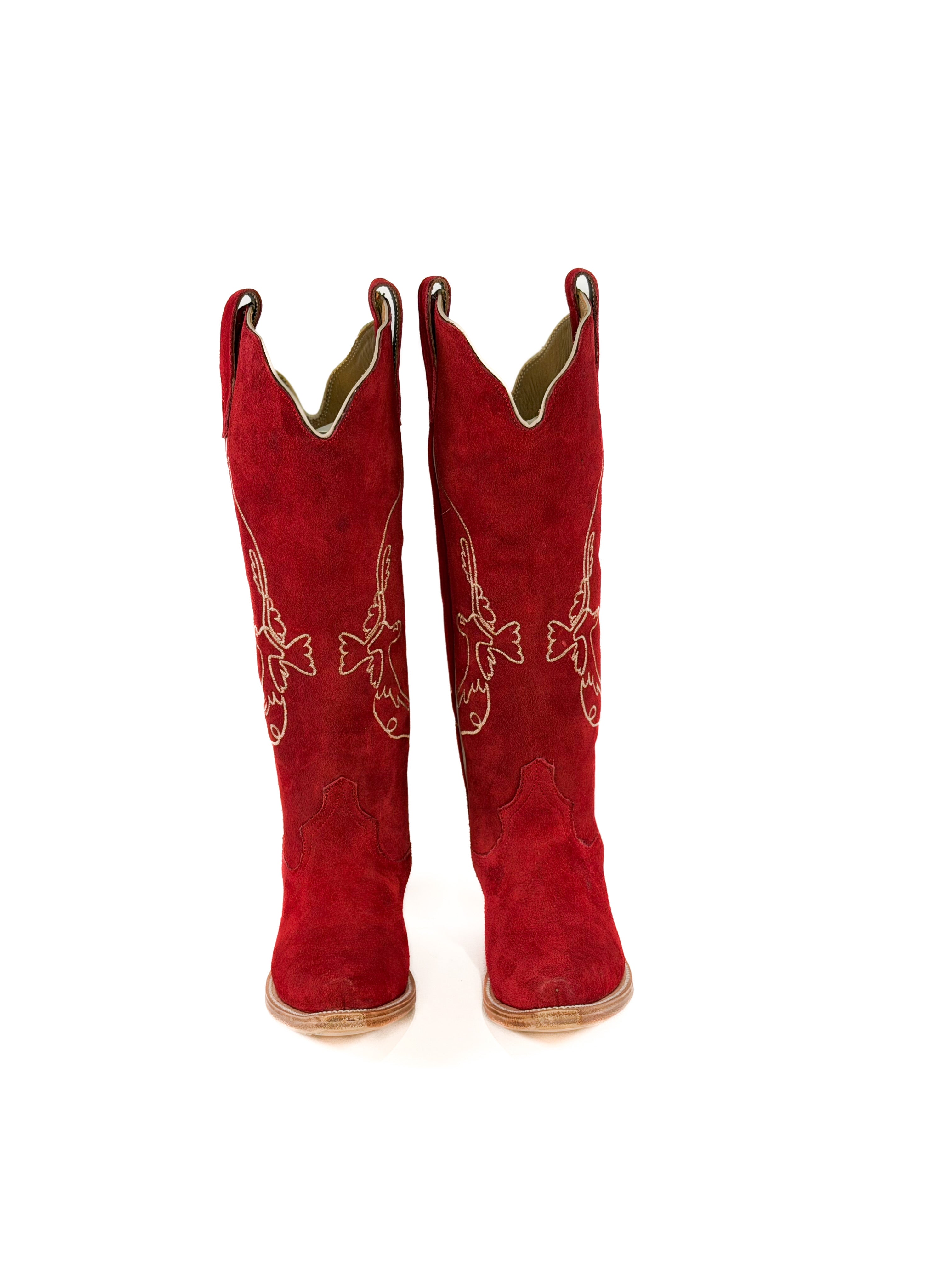 pair of red suede cowgirl boots with gold bird detailing