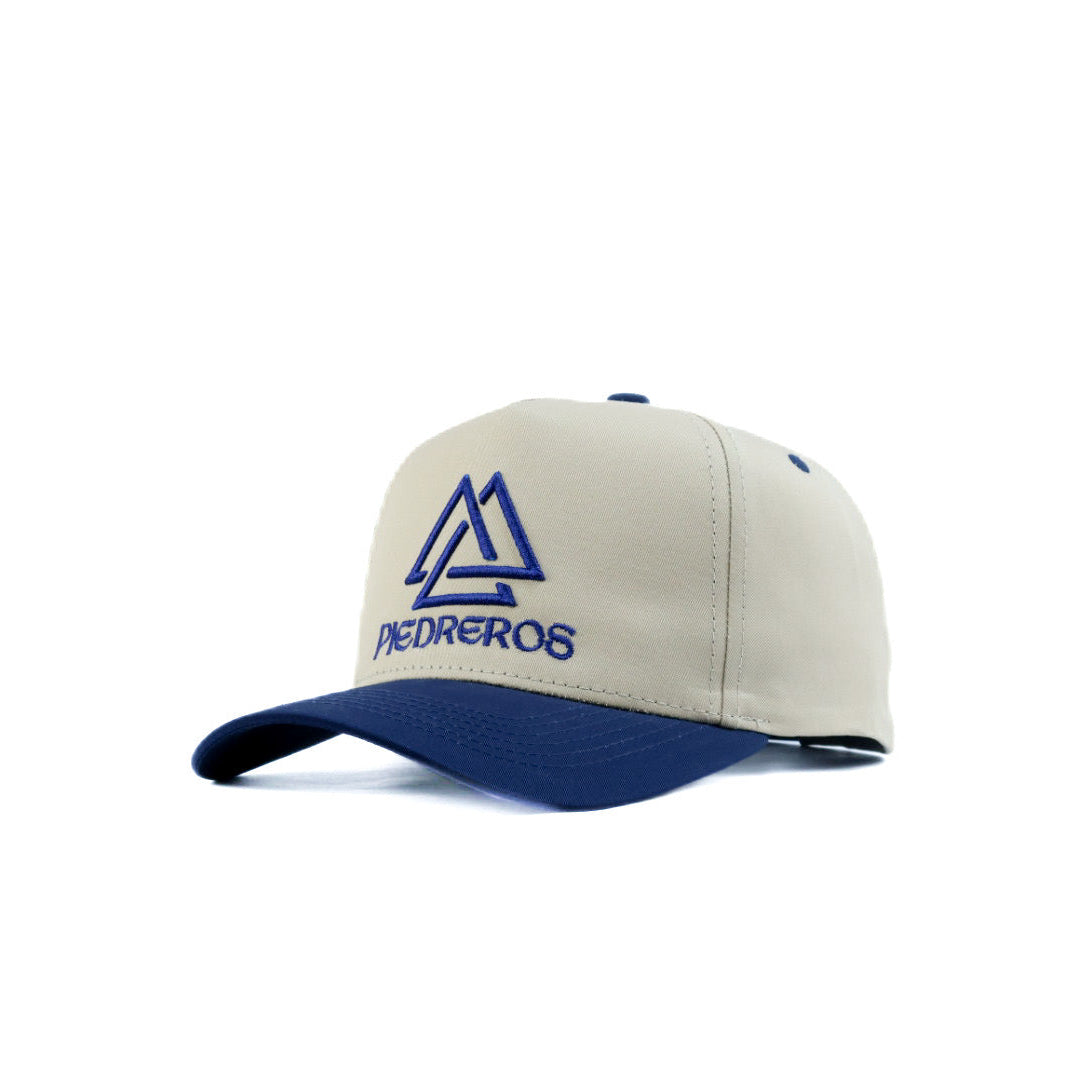 Beige and blue cap with a logo on a white background