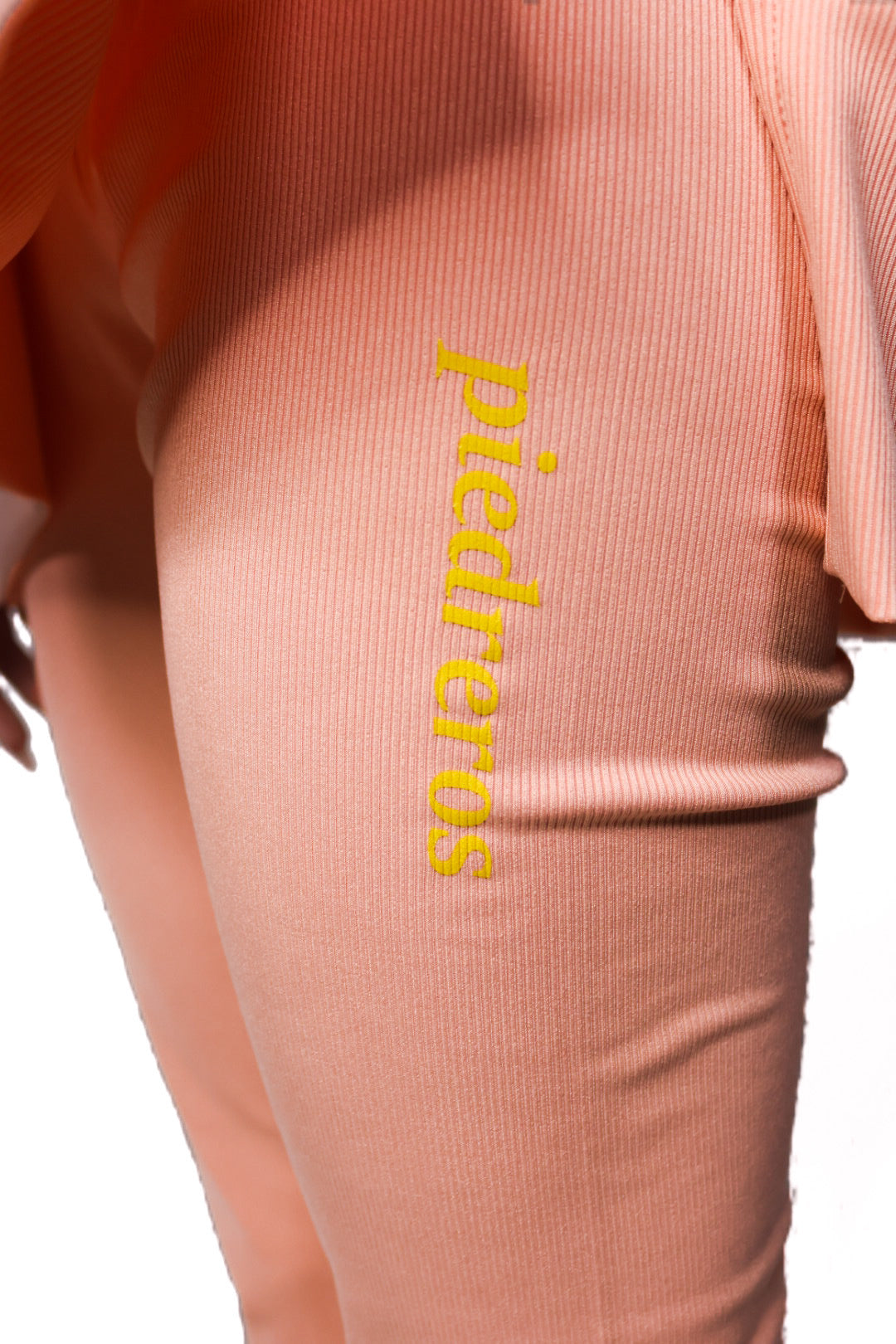 Close up of Peach sports set with piedreros logo