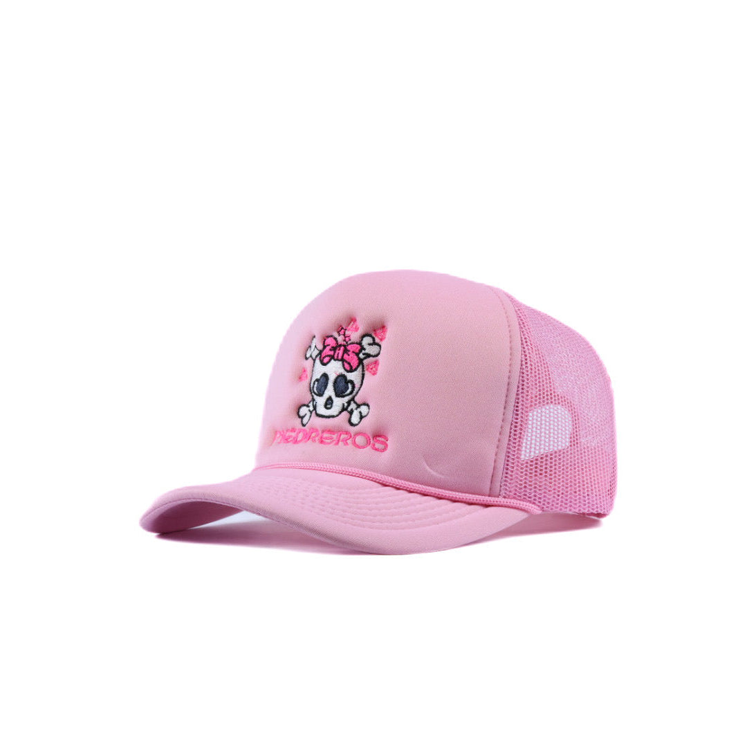 Pink girls cap with Piedreros logo and skull icon