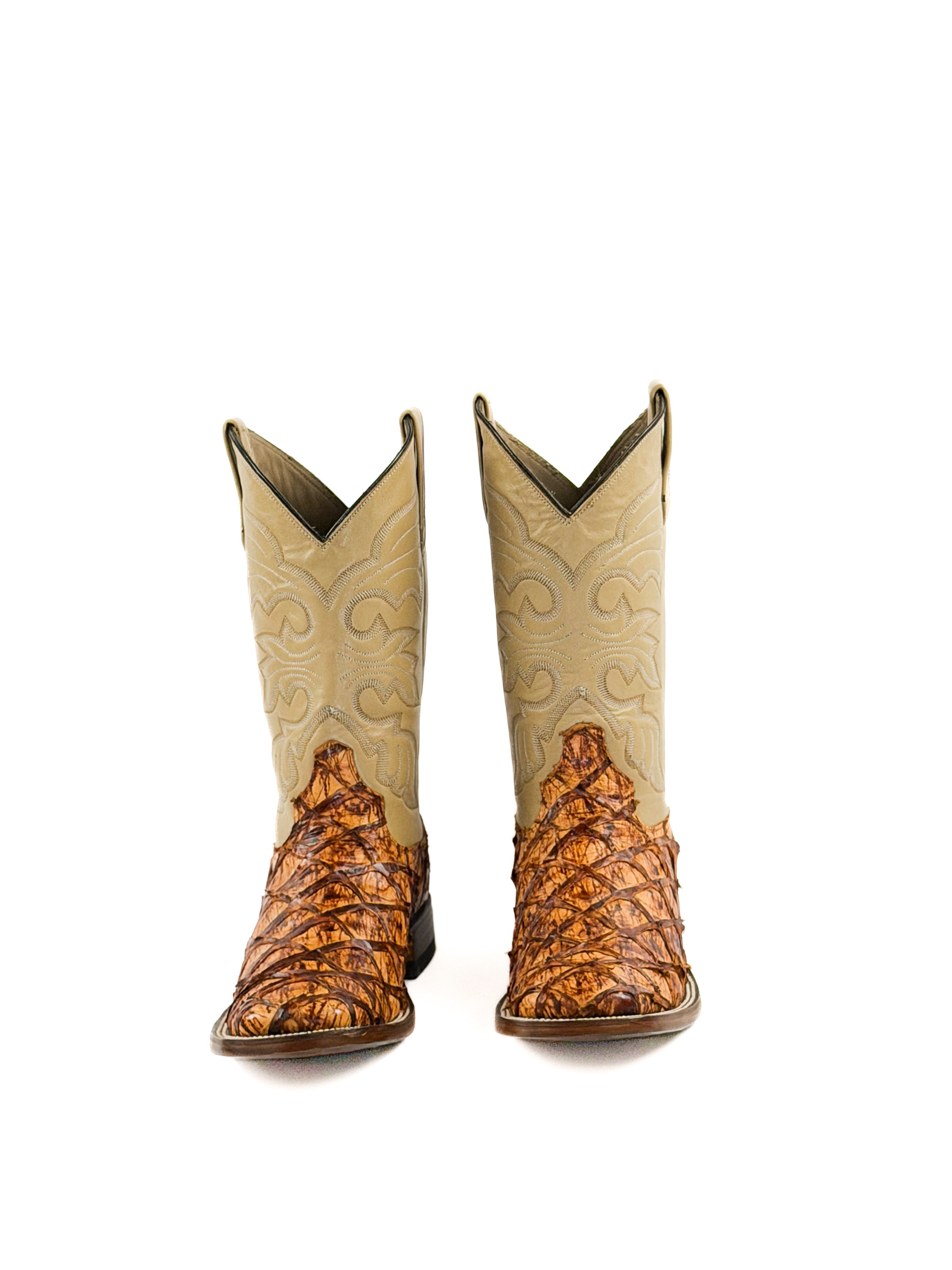 Pair of orange and brown cowboy boots with a beige stitched upper shaft