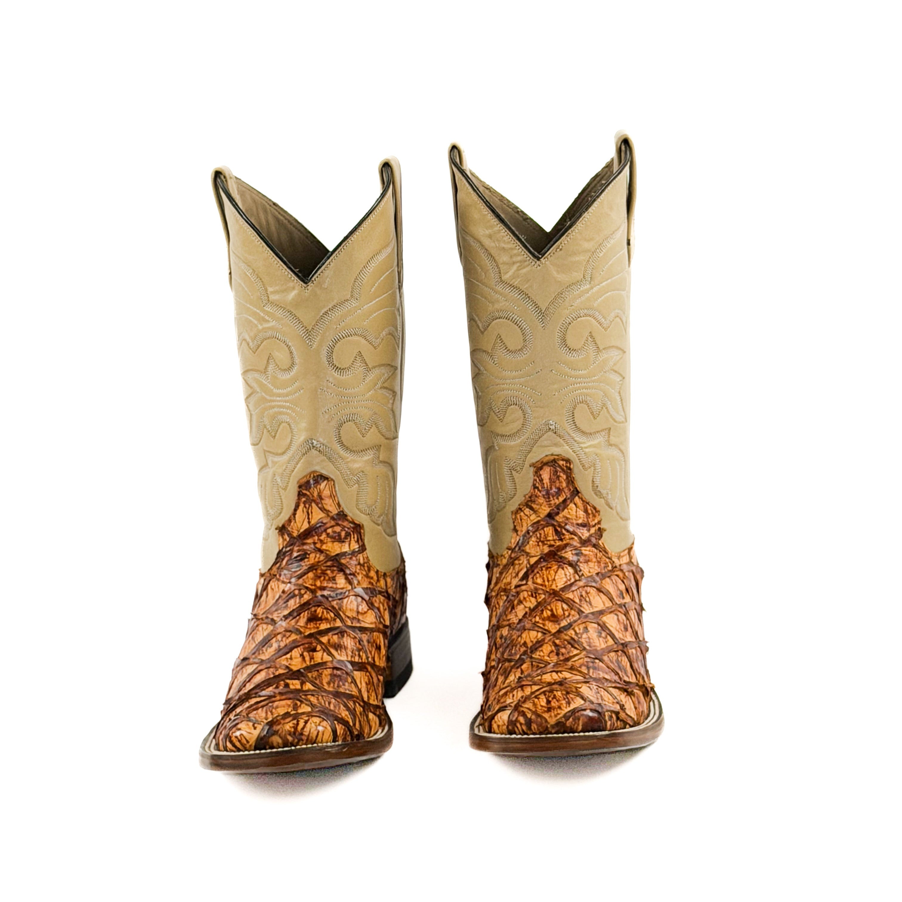 Pair of orange and brown cowboy boots with a beige stitched upper shaft