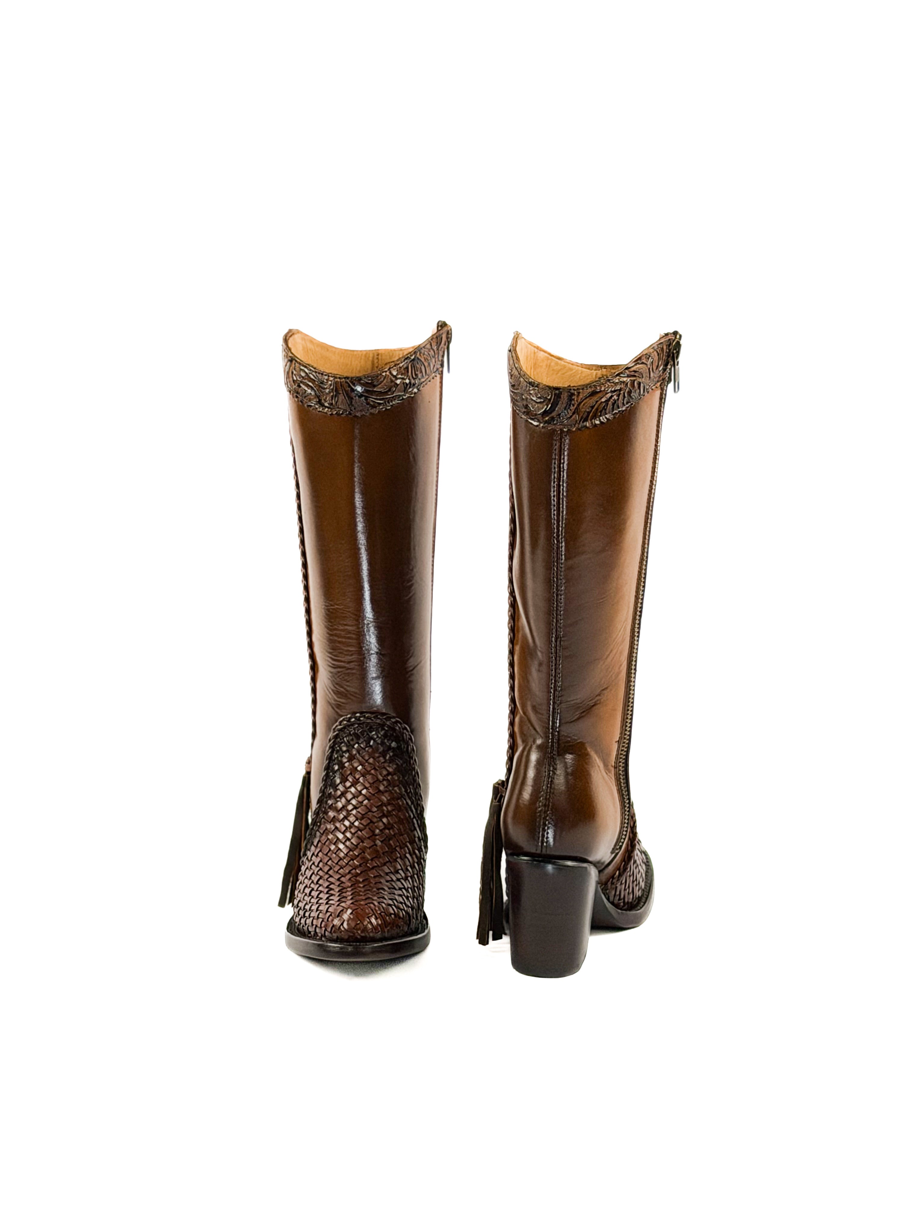 Pair of honey brown womens boots with woven details on the round toe