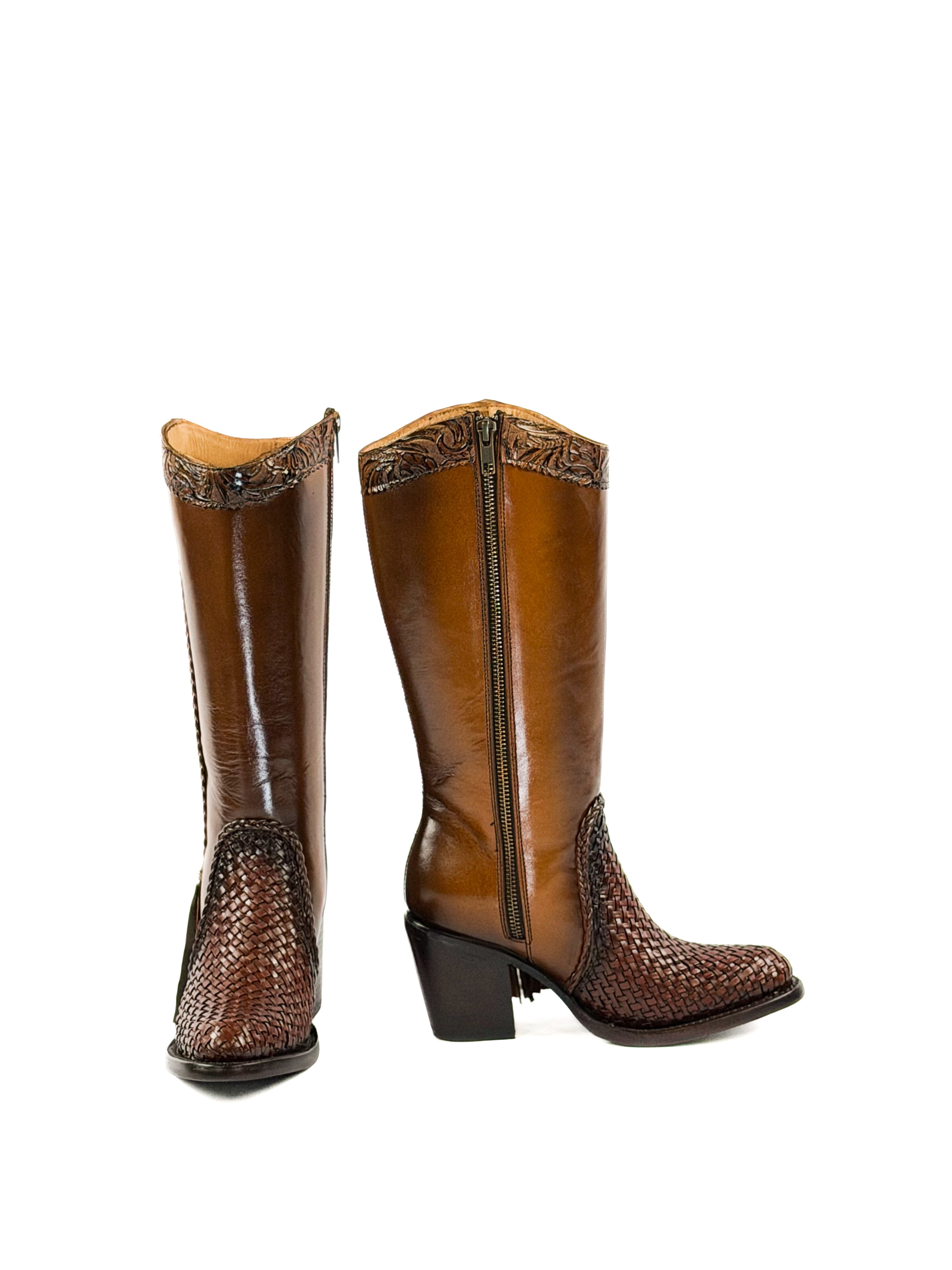 Pair of brown knee-high boots with snake skin pattern on a white background