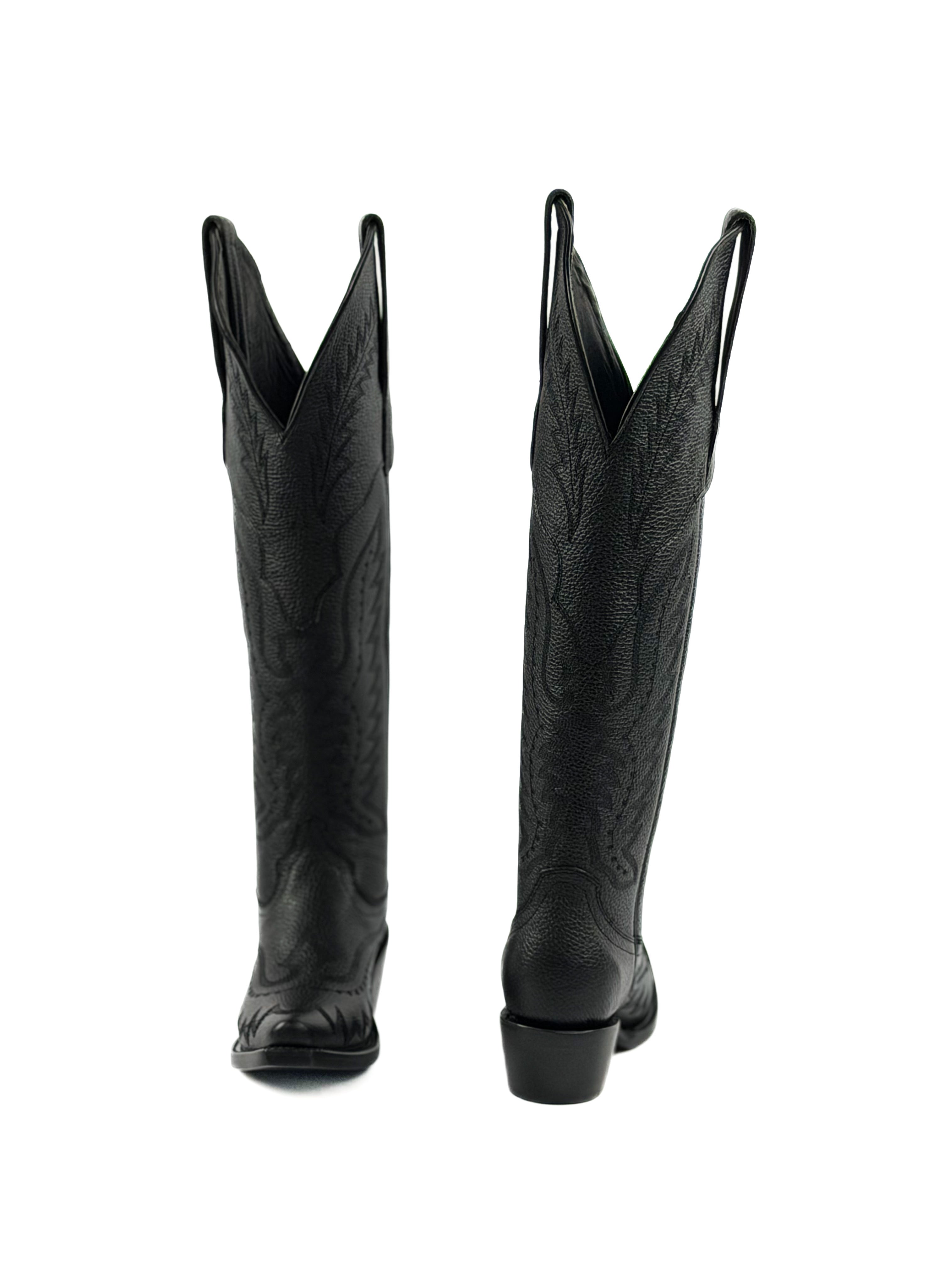 Pair of black knee-high cowgirl boots with intricate stitching designs and 2 inch heel