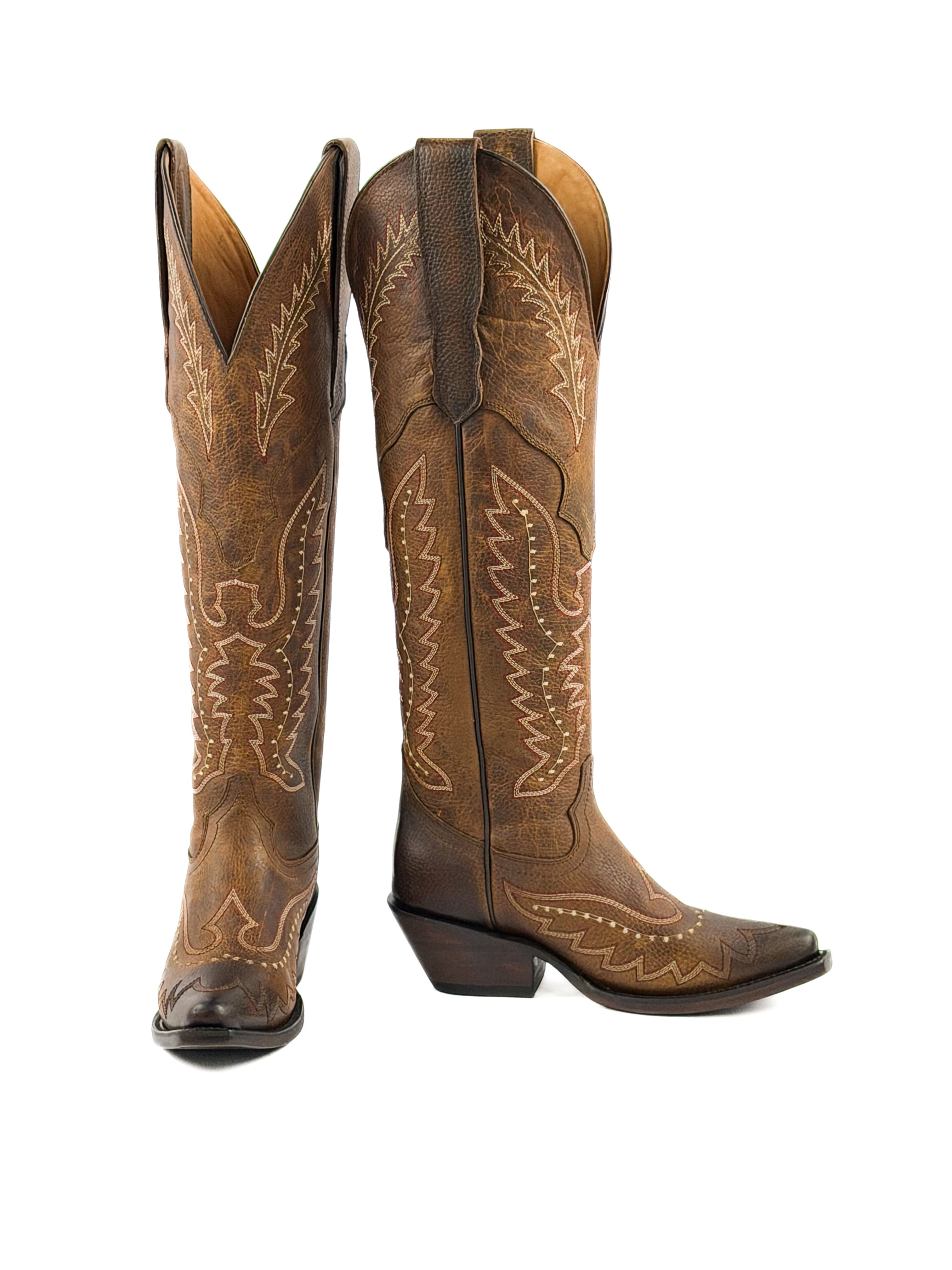Pair of honey brown womens snip toe boots with intricate stitching