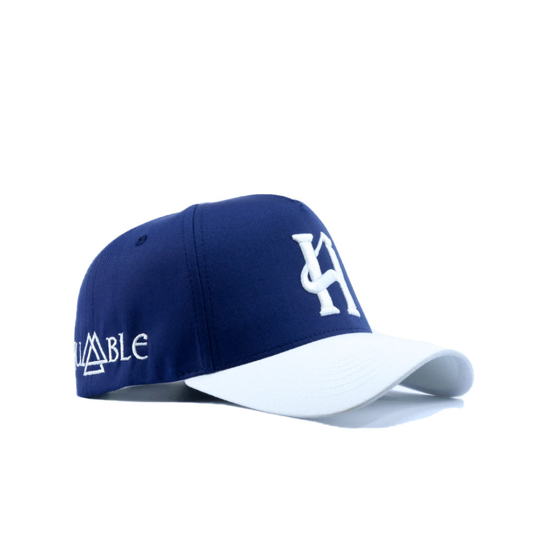 Blue and white cap with branding on a white background