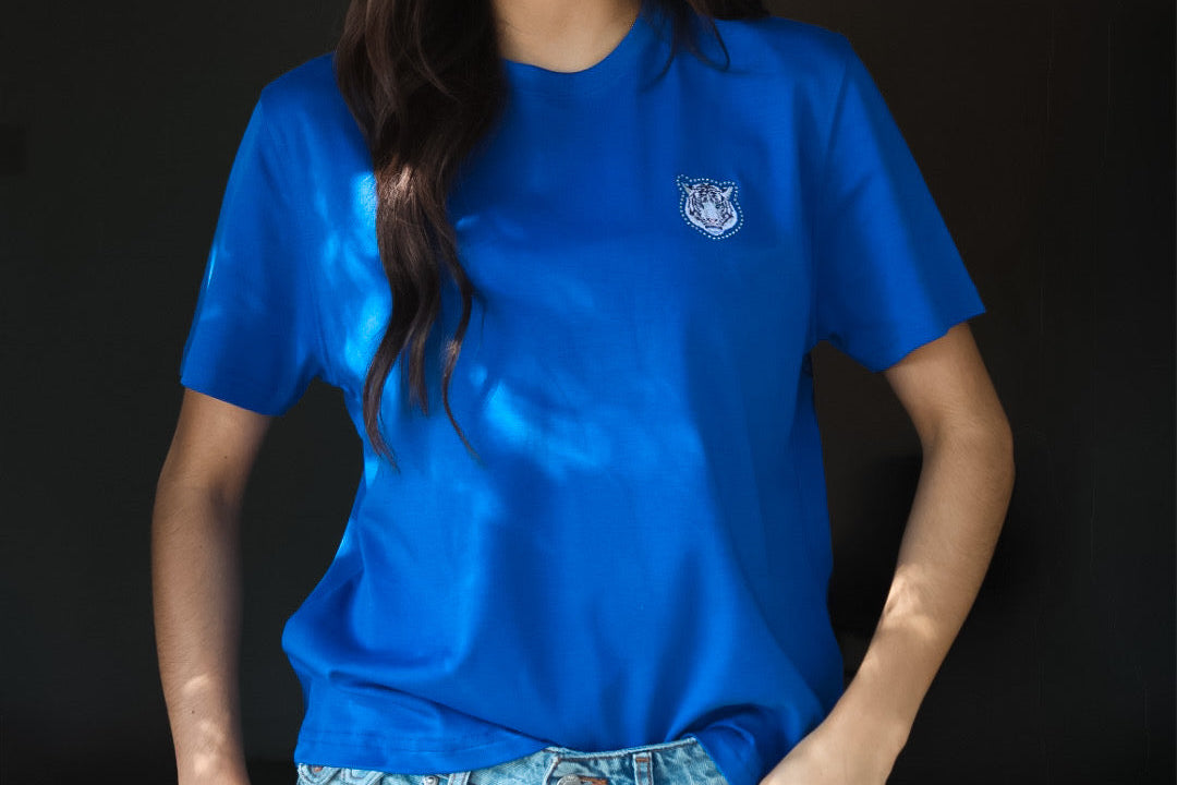 Women Wearing a blue piedreros shirt