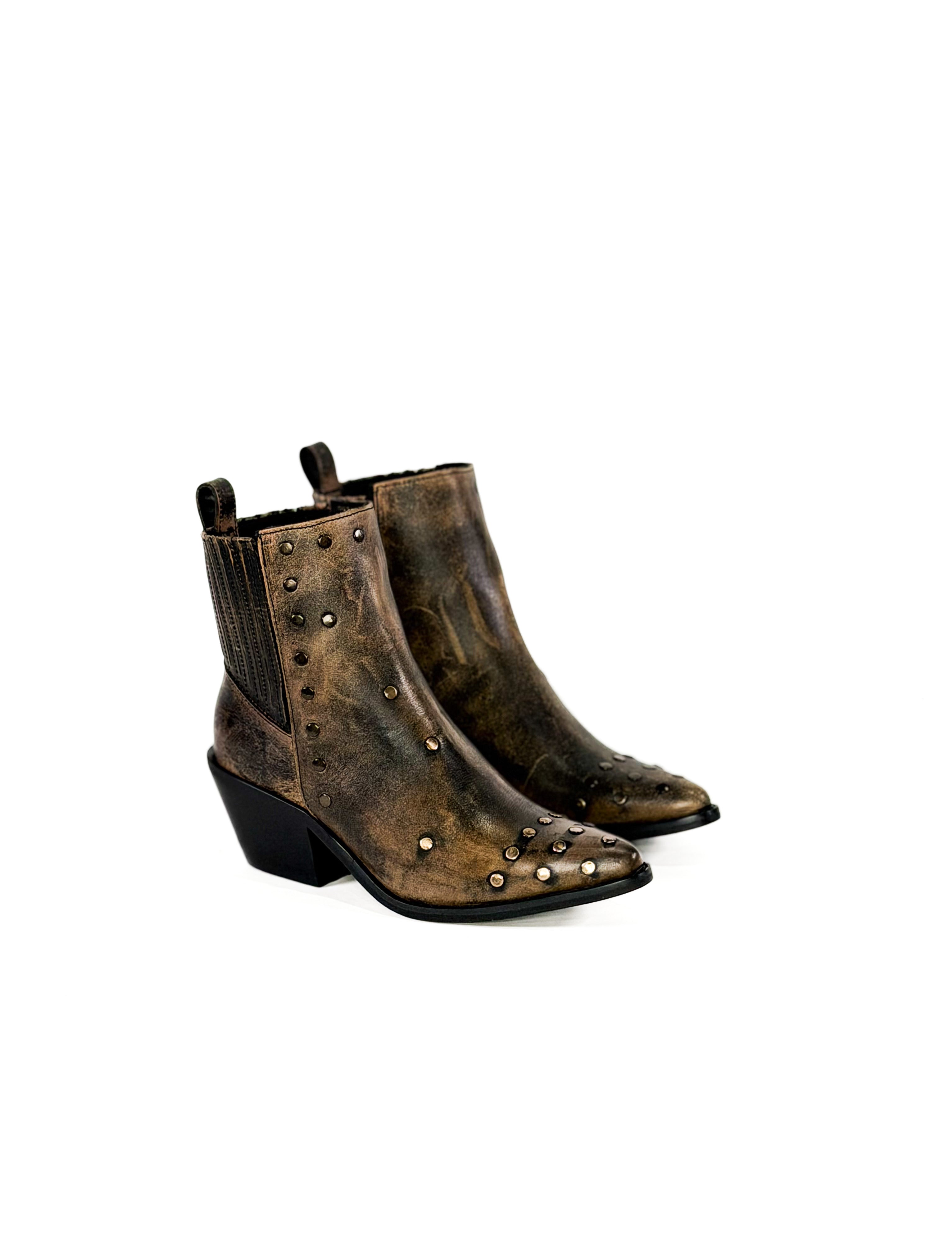 Pair of brown leather boots with studded details on a white background