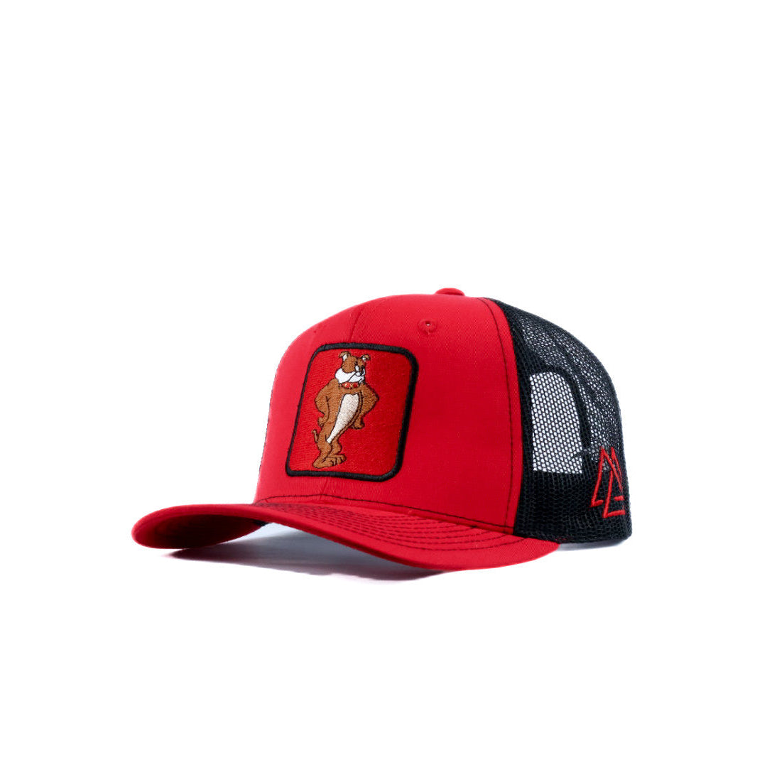 Red and black cap with a bulldog and piedreros logo