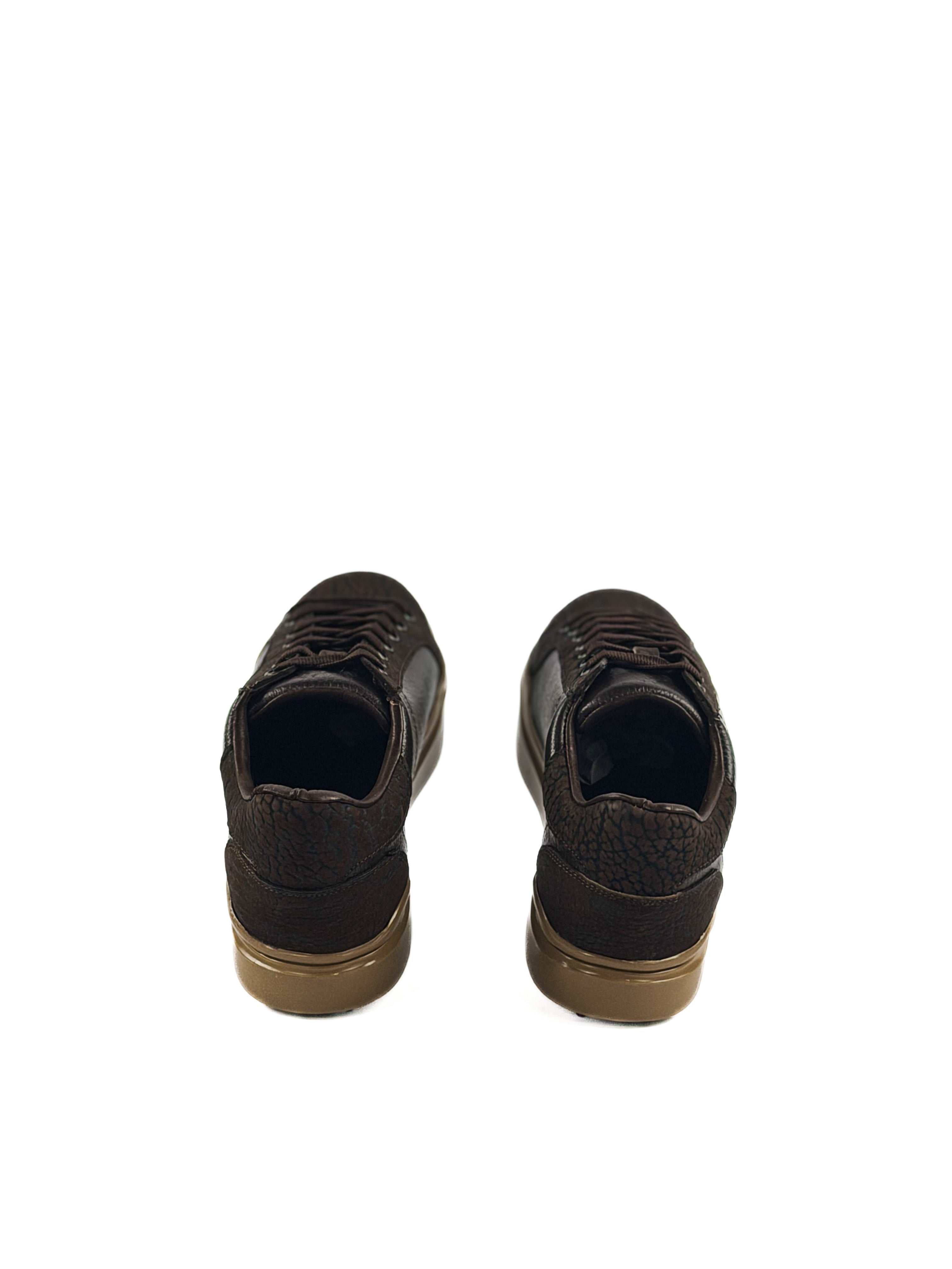 Pair of brown bulls neck laced sneakers with tan soles and durable traction