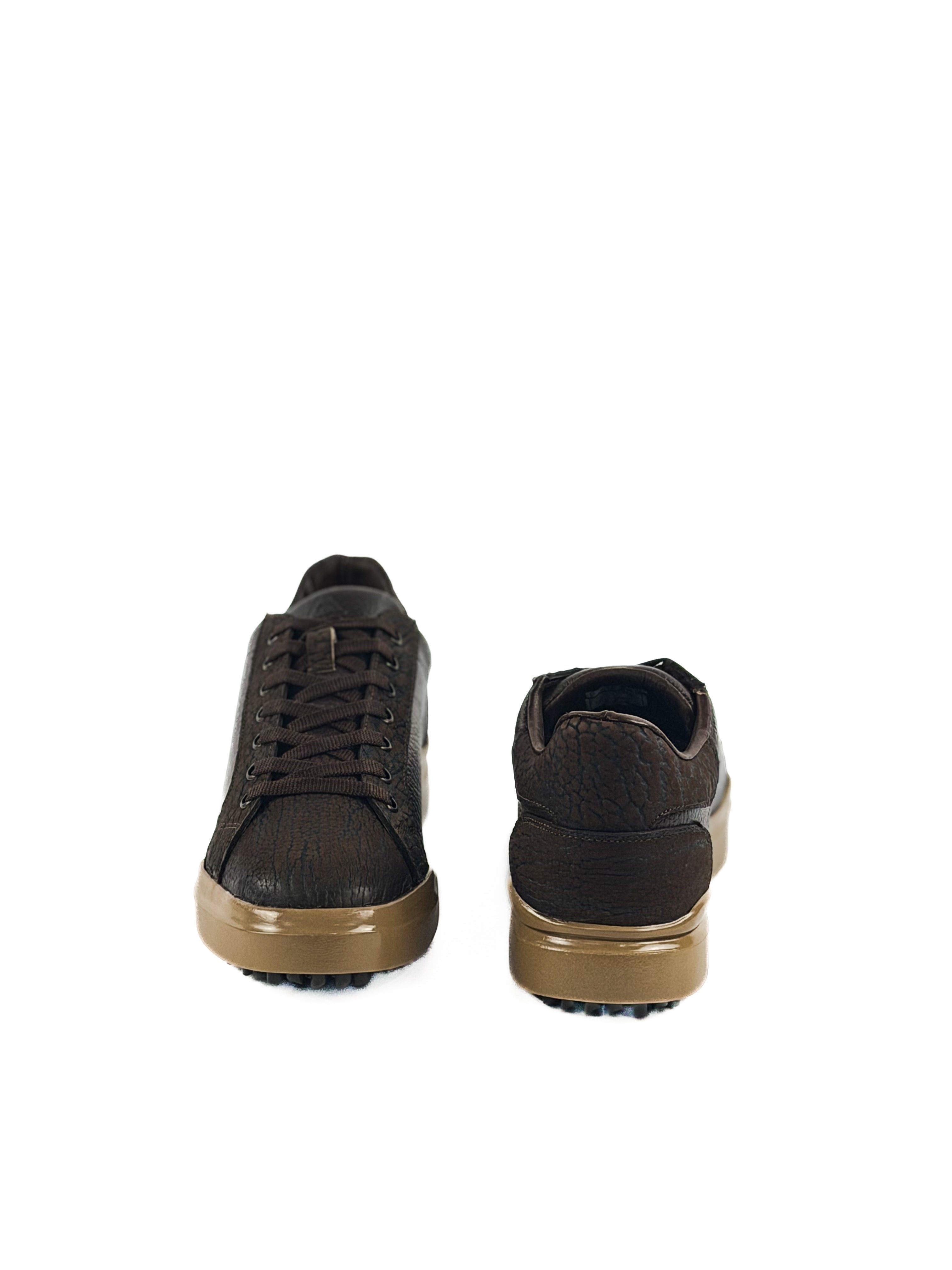 Pair of brown bulls neck laced sneakers with tan soles and durable traction