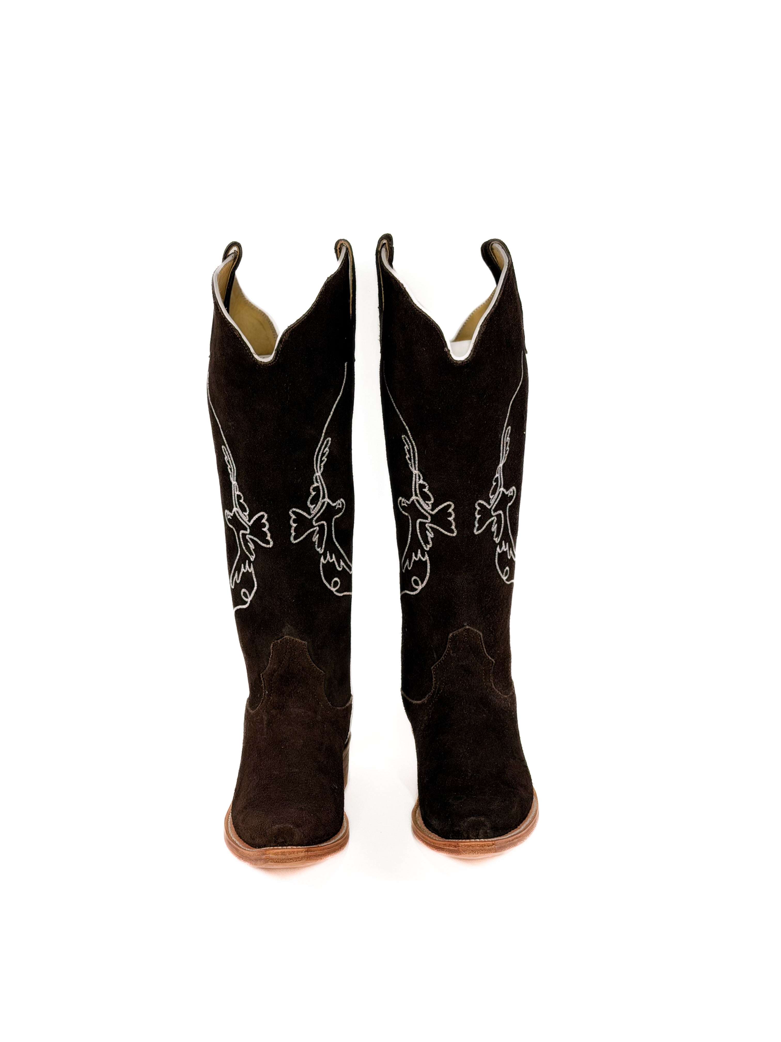 pair of brown suede cowgirl boots with white bird detailing
