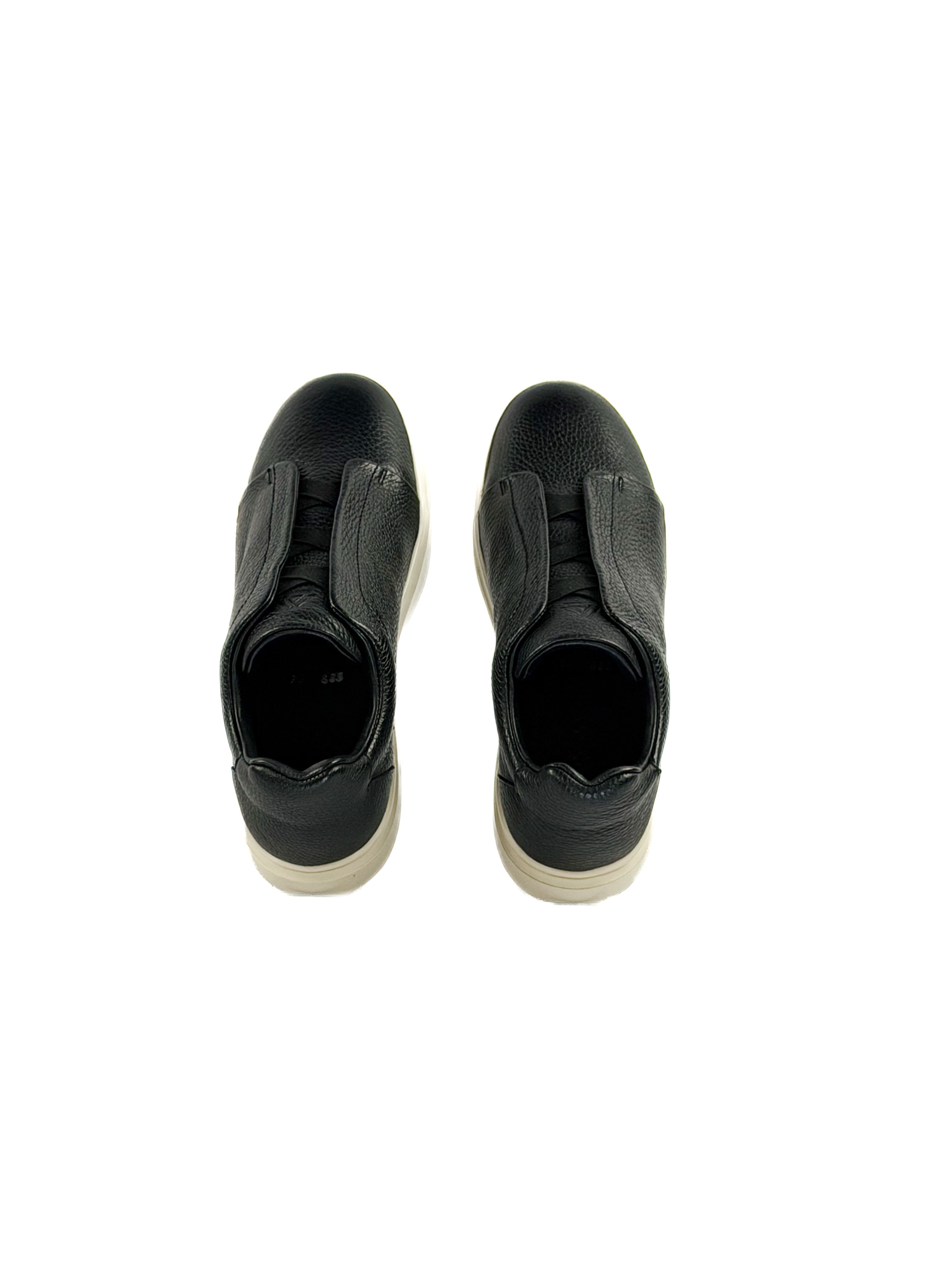 Black slip-on deer sneakers with durable traction