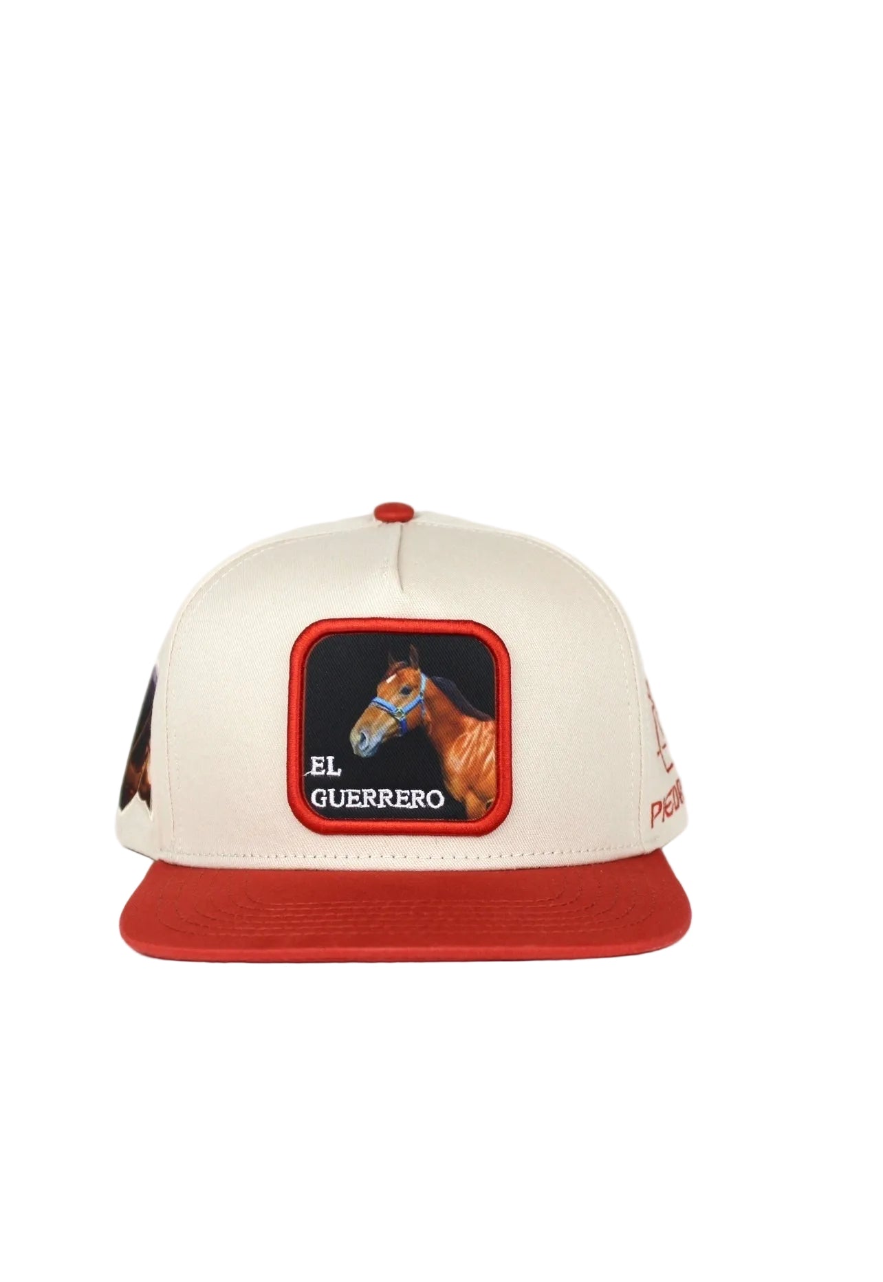 A beige and red baseball cap with 3D embroidered text and an image of el guerrero horse on the front.