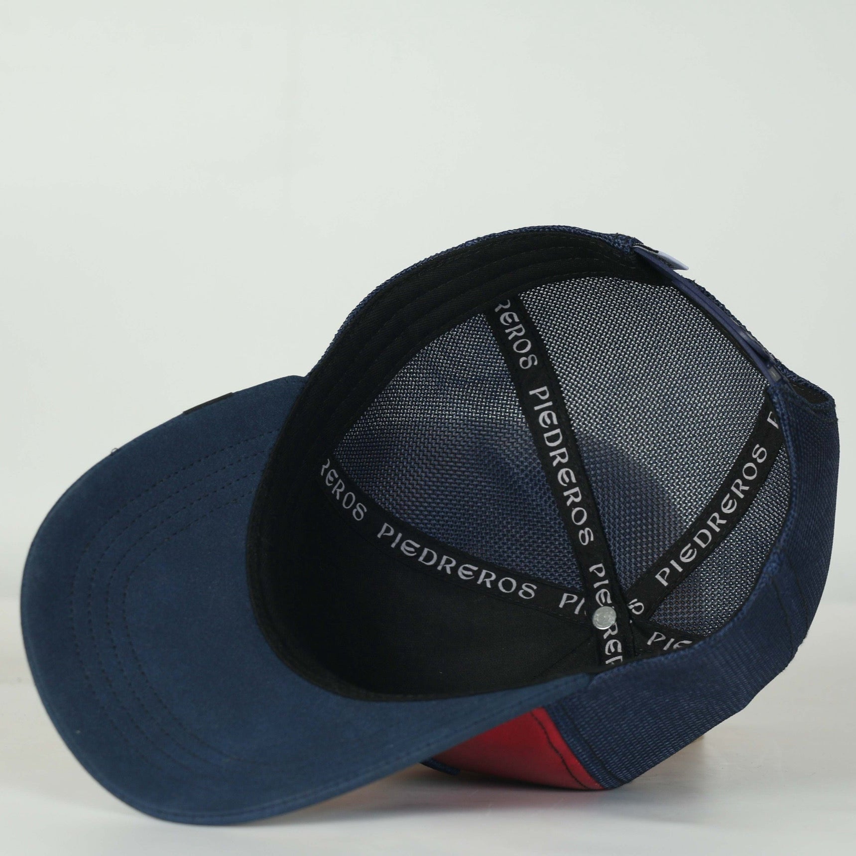 Leather Caps — profile view of Cuadra Piedreros cap
