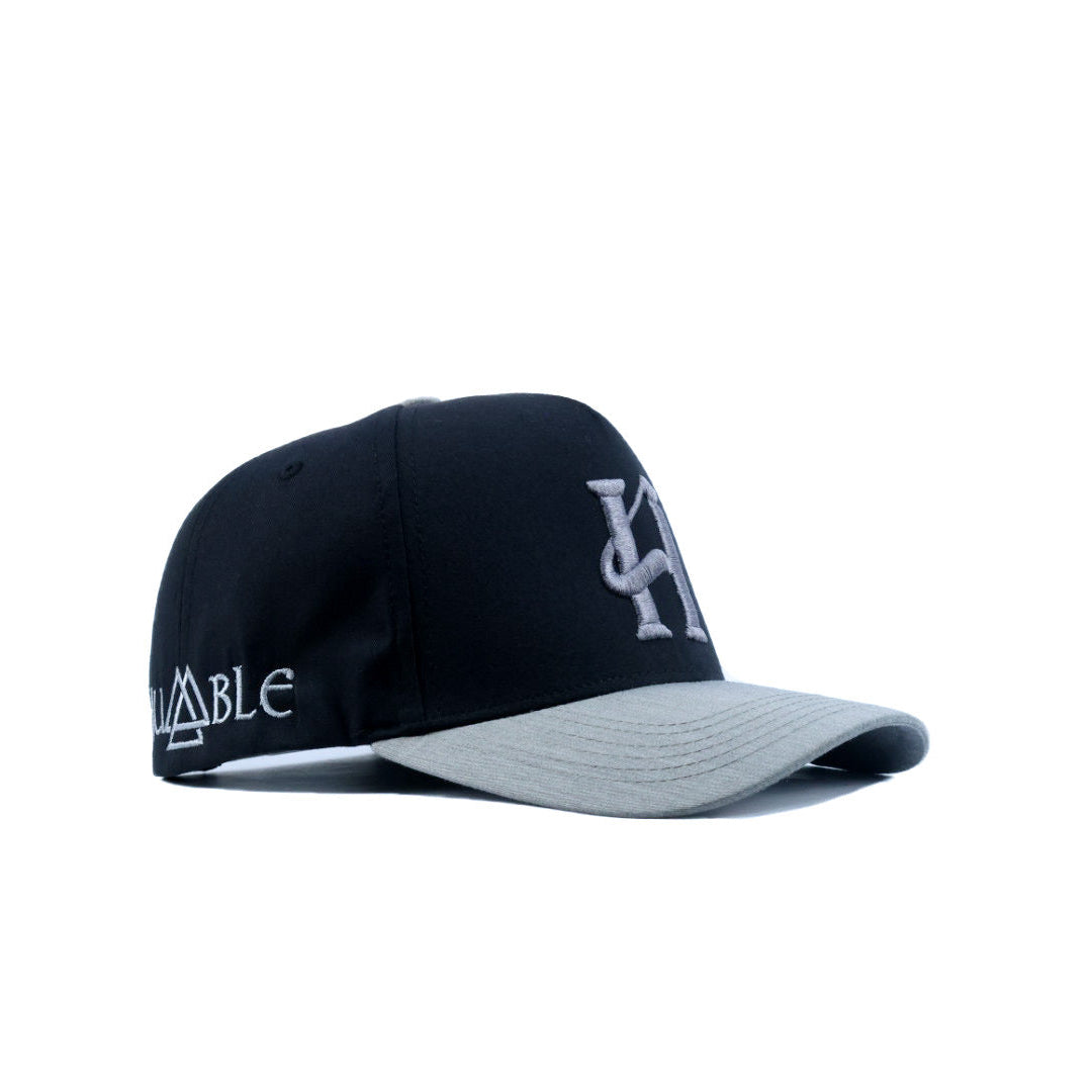Black and gray cap with branding on a white background