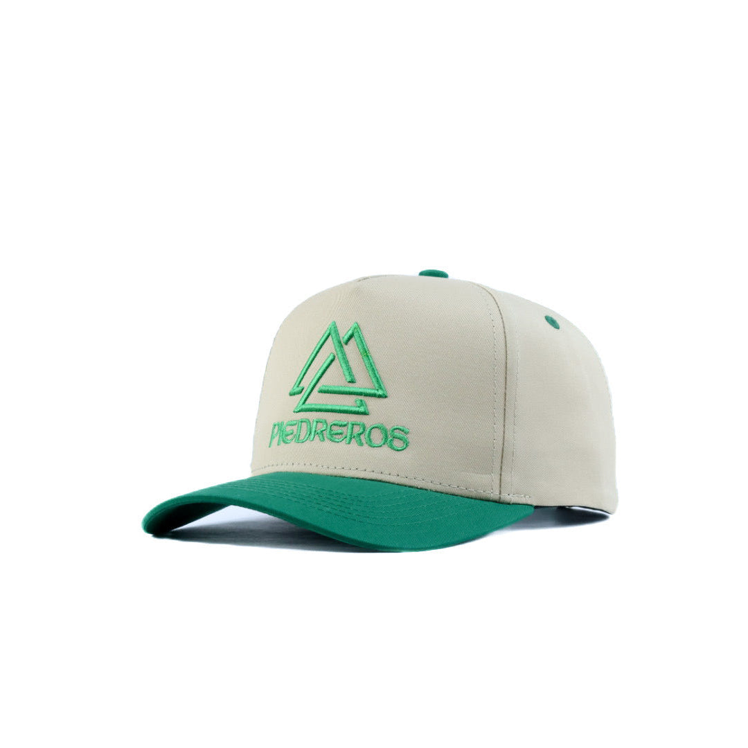 Beige and green cap with a piedreros logo