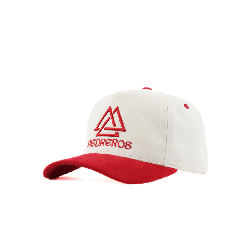 Cream cap with red suede brim and red piedreros logo