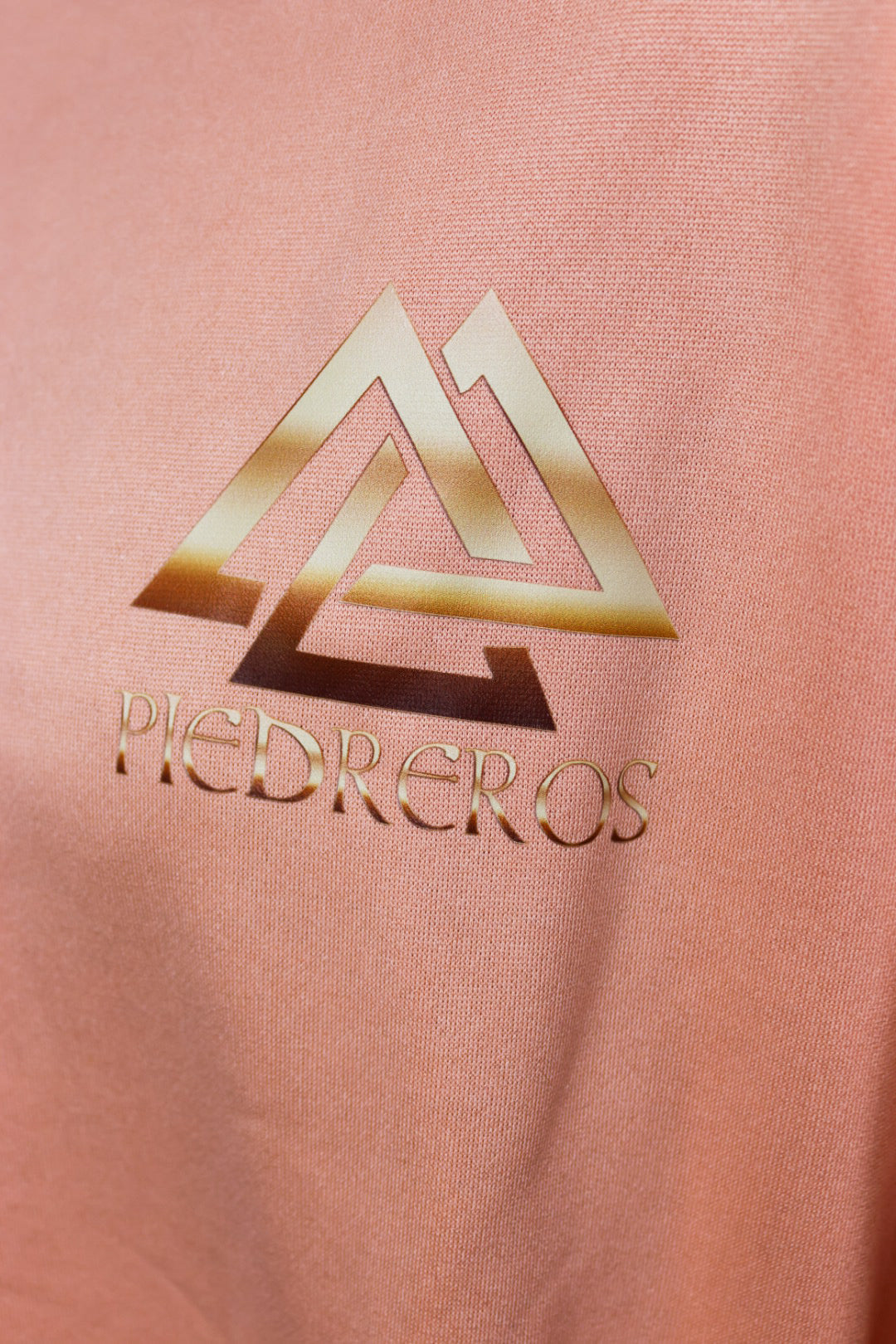 Peach sports set with piedreros logo