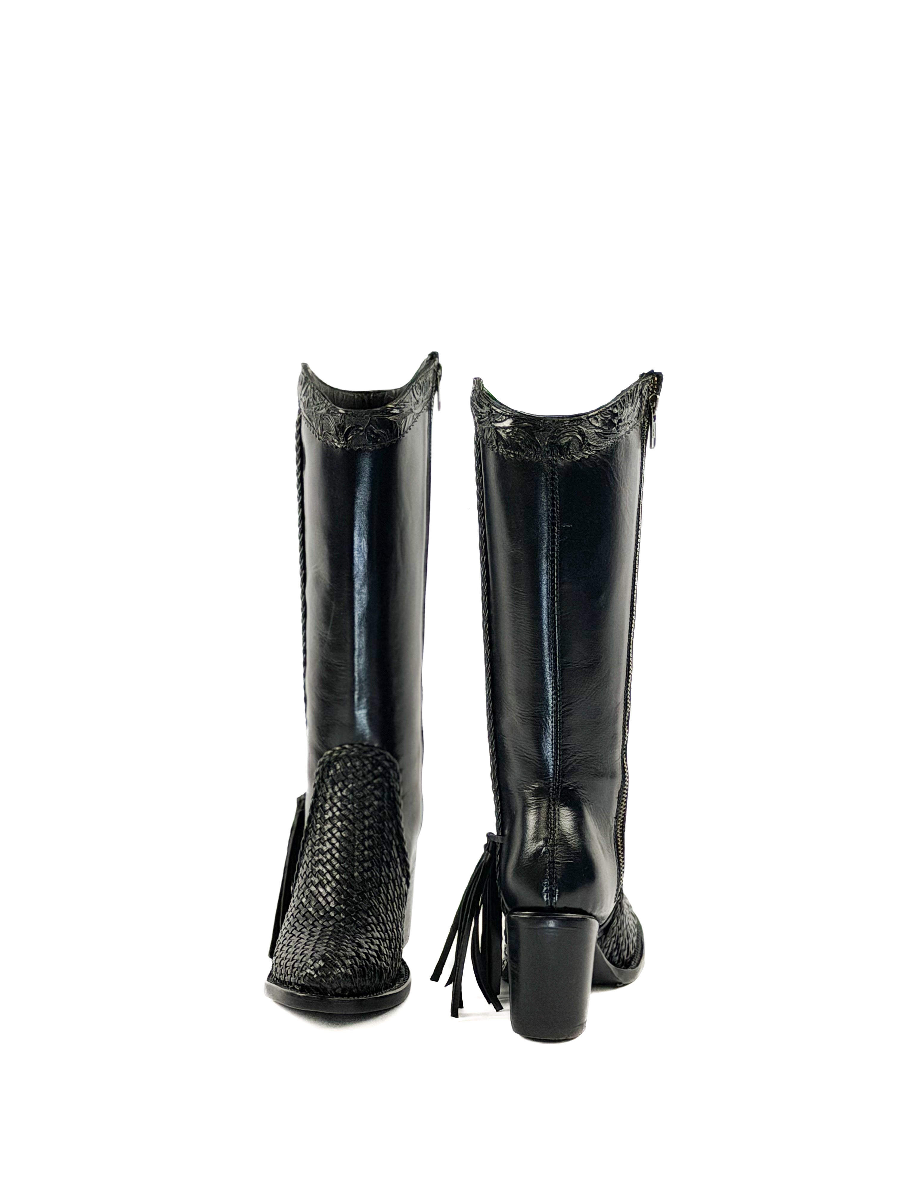 Pair of black mid calf leather boots with round toe knitted design.               
