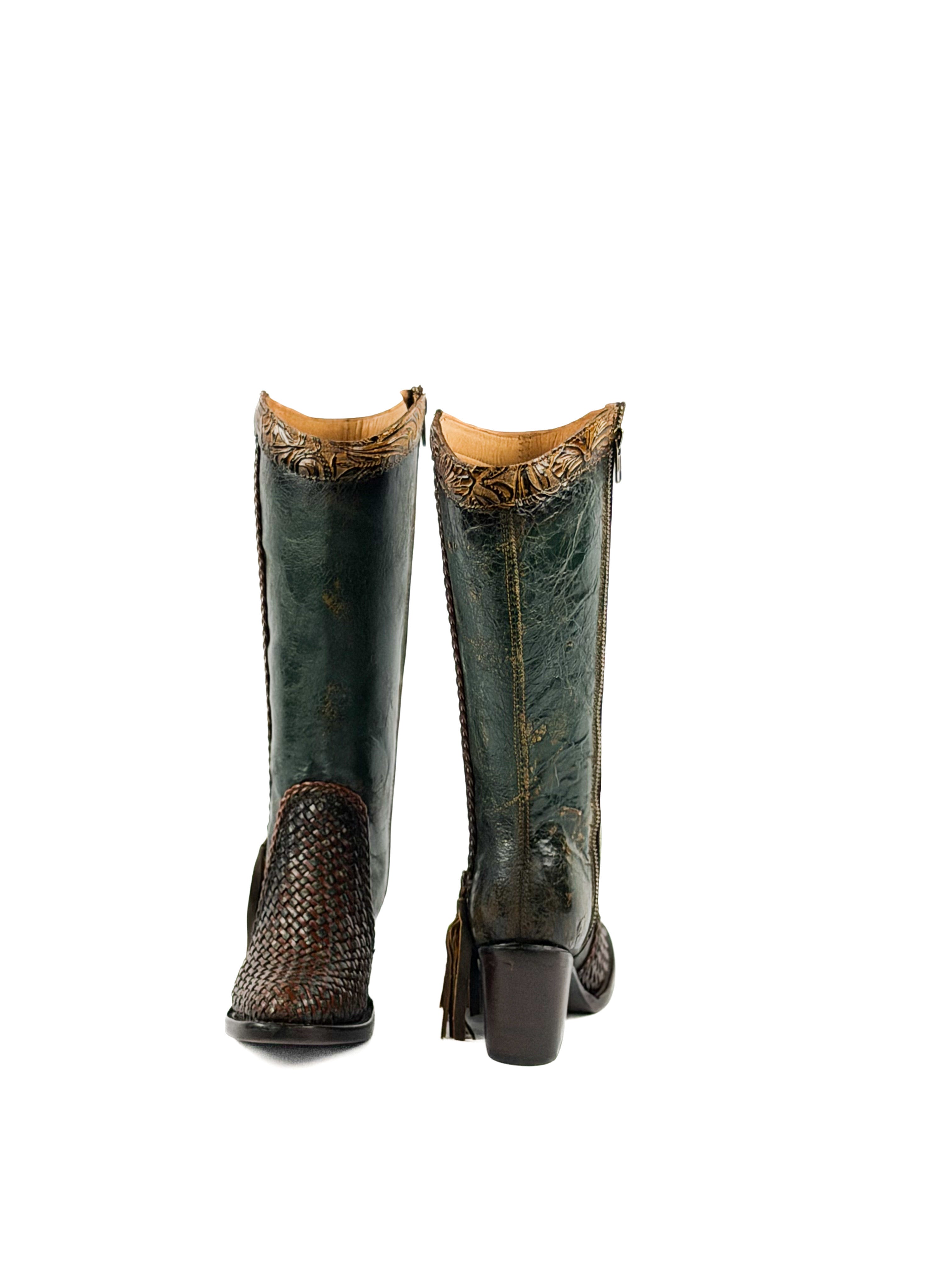 Pair of green leather boots with brown decorative elements and a 3 inch heel