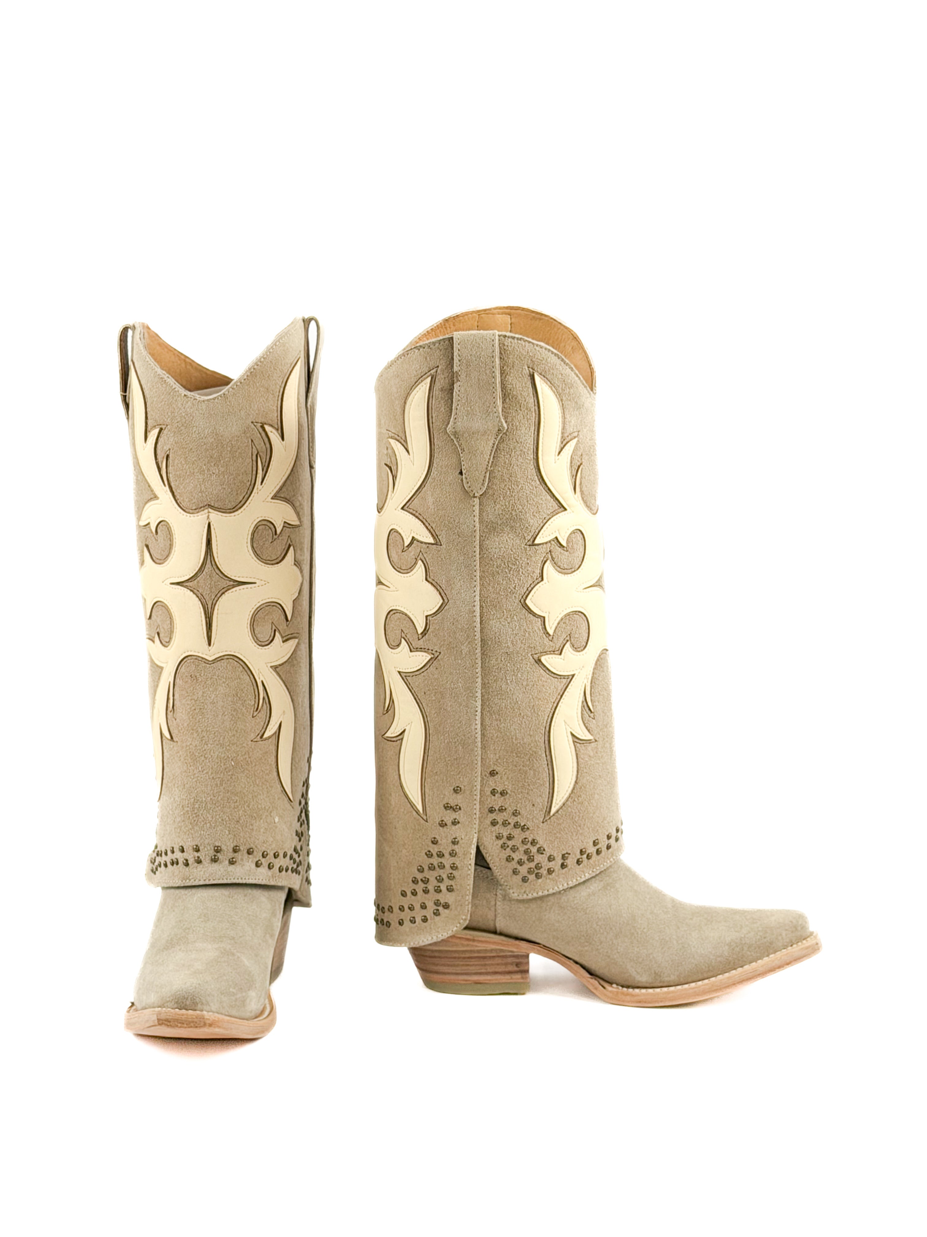 Pair of beige snip toe women’s boots with masquerade patterns and studded shaft