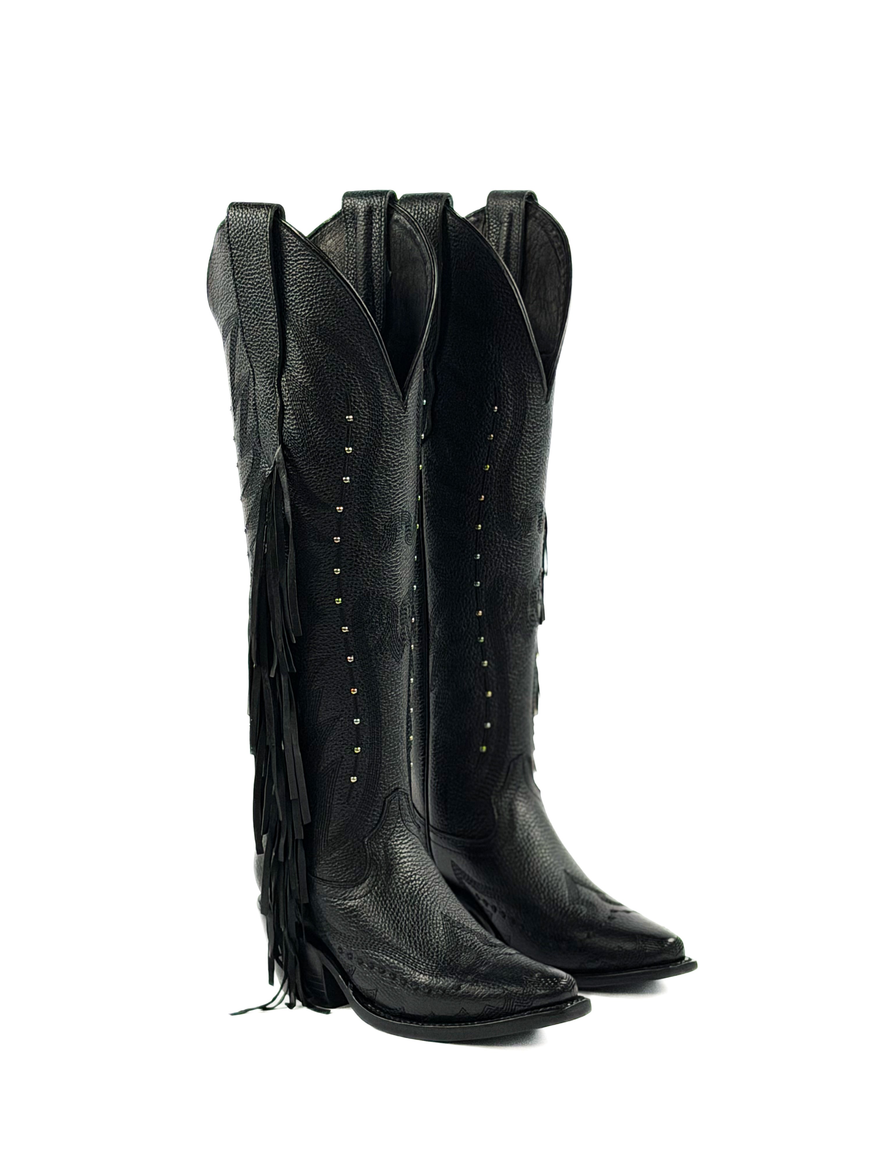 Pair of black snip toe cowgirl boots with fringes, silver studs, and 2 inch heel
