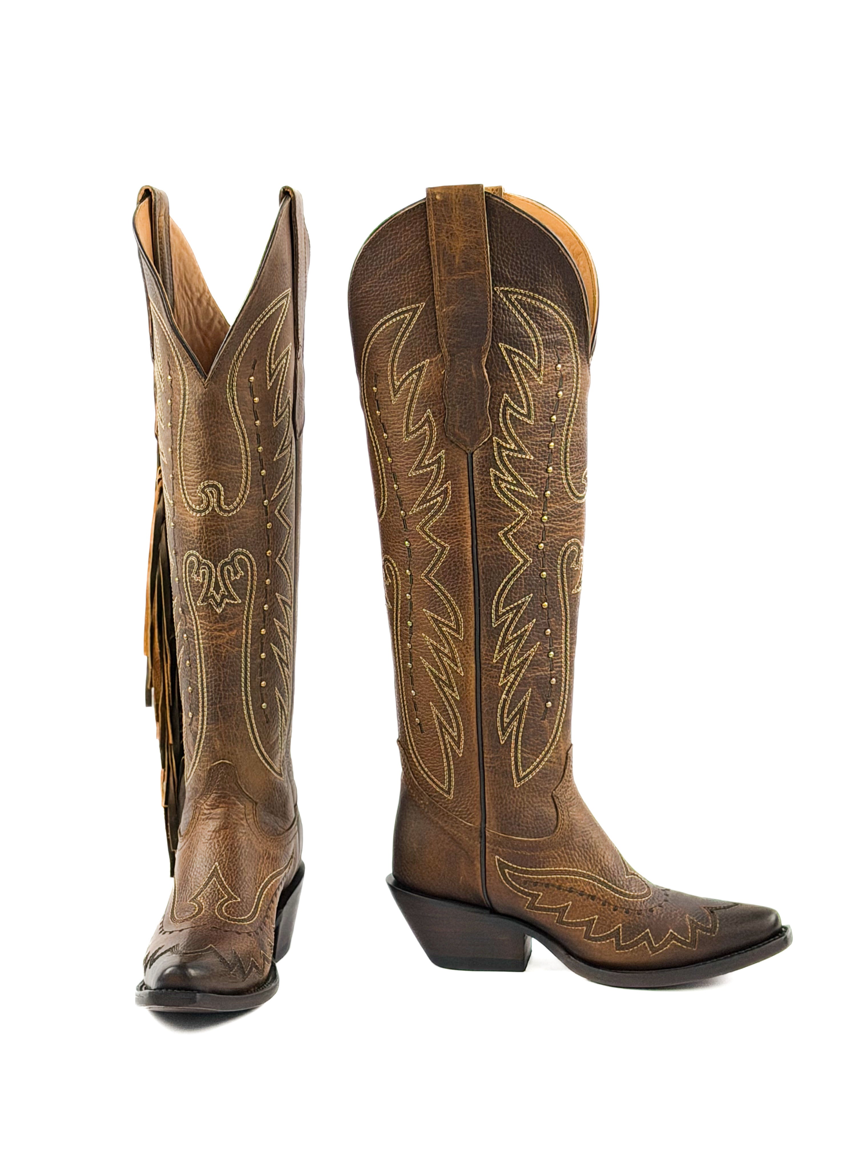 Pair of honey snip toe cowgirl boots with fringe and 2 inch heel