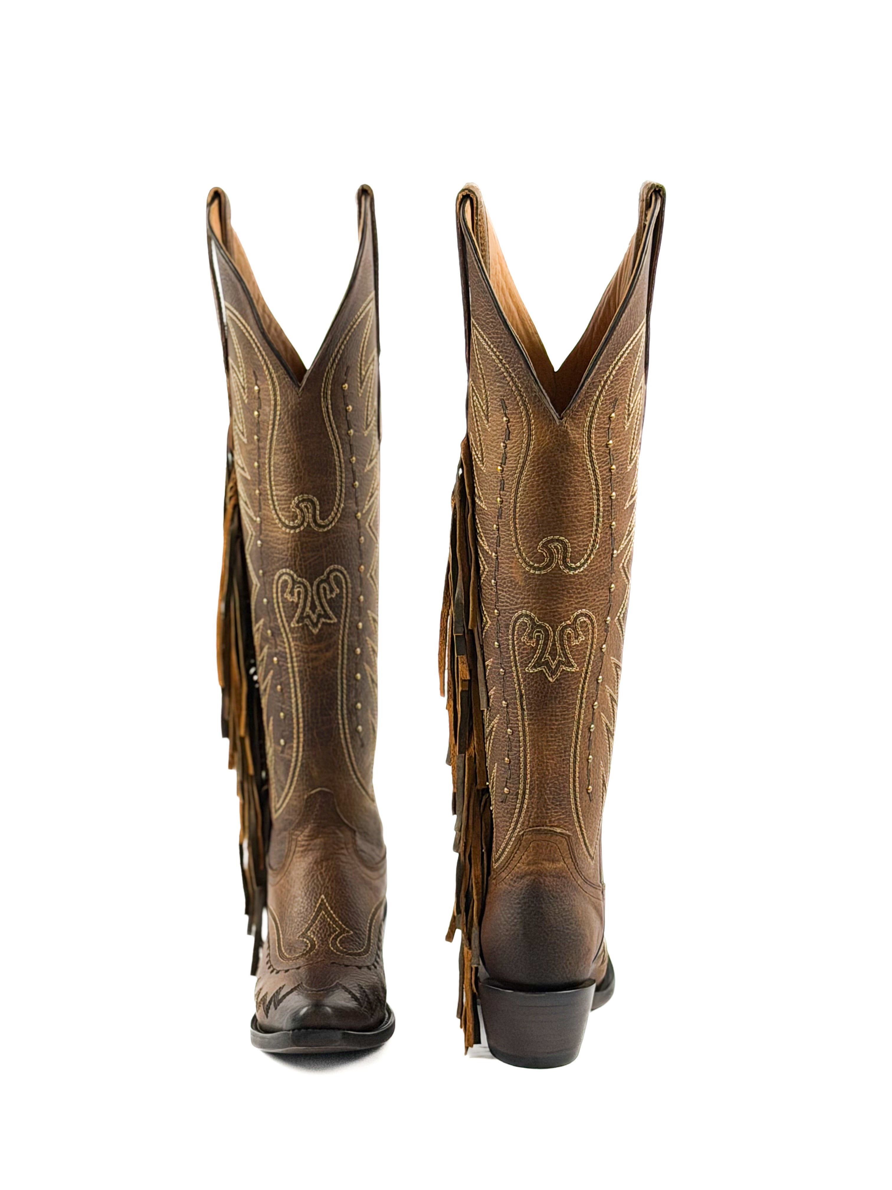Pair of honey snip toe cowgirl boots with fringe and 2 inch heel
