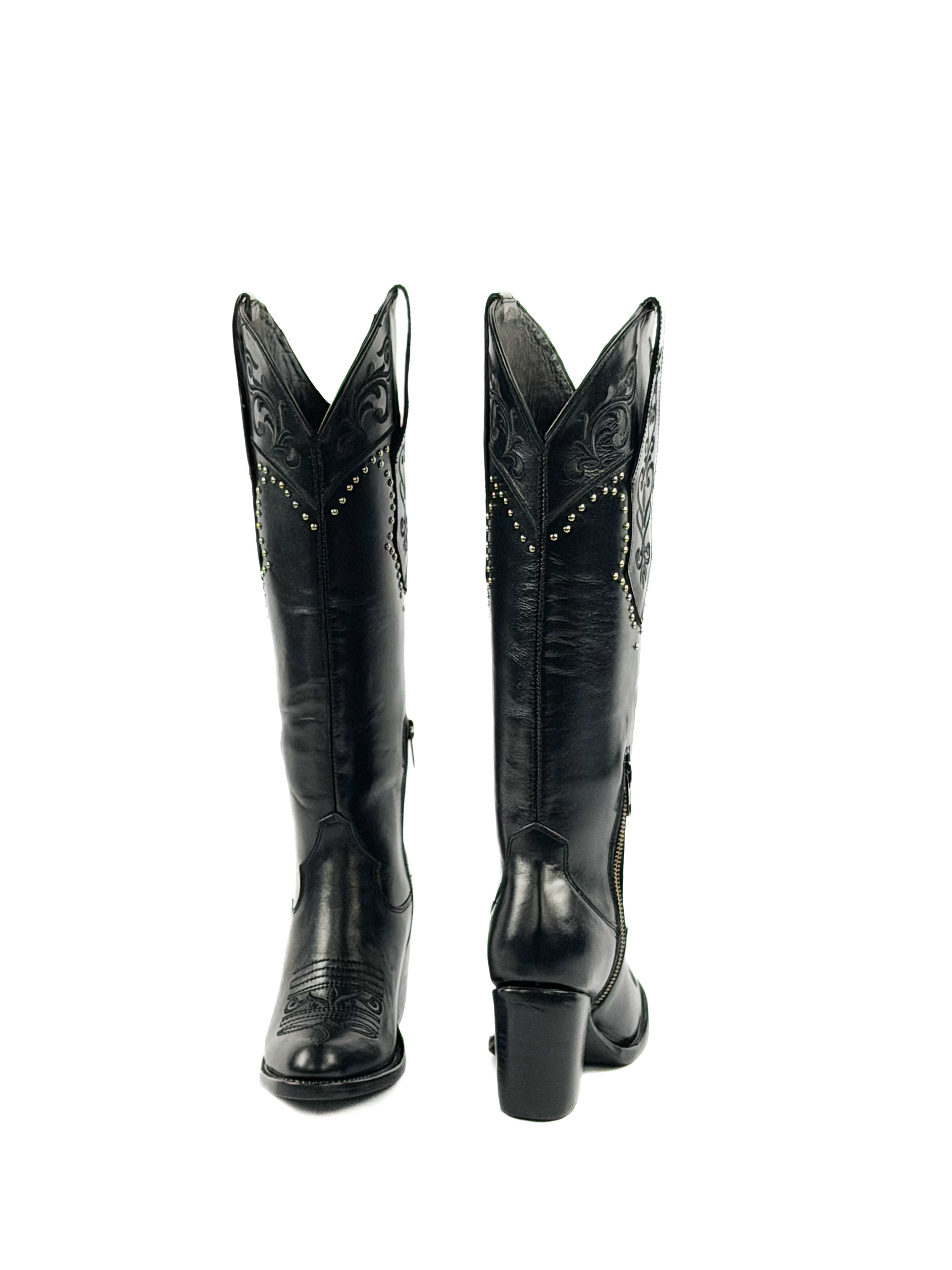 Pair of black round toe boots with studded and design elements on the shaft