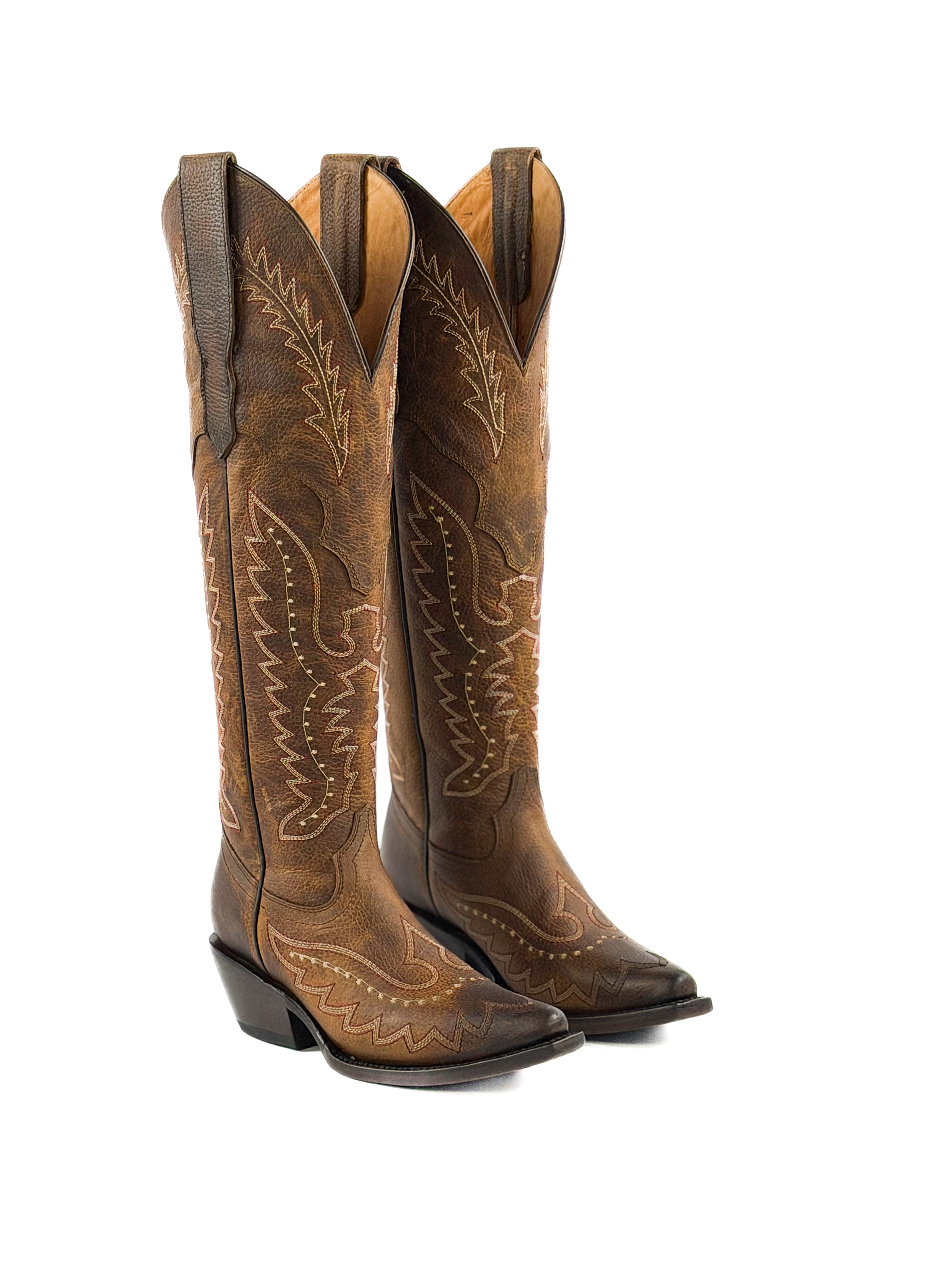 Pair of honey brown womens snip toe boots with intricate stitching  
