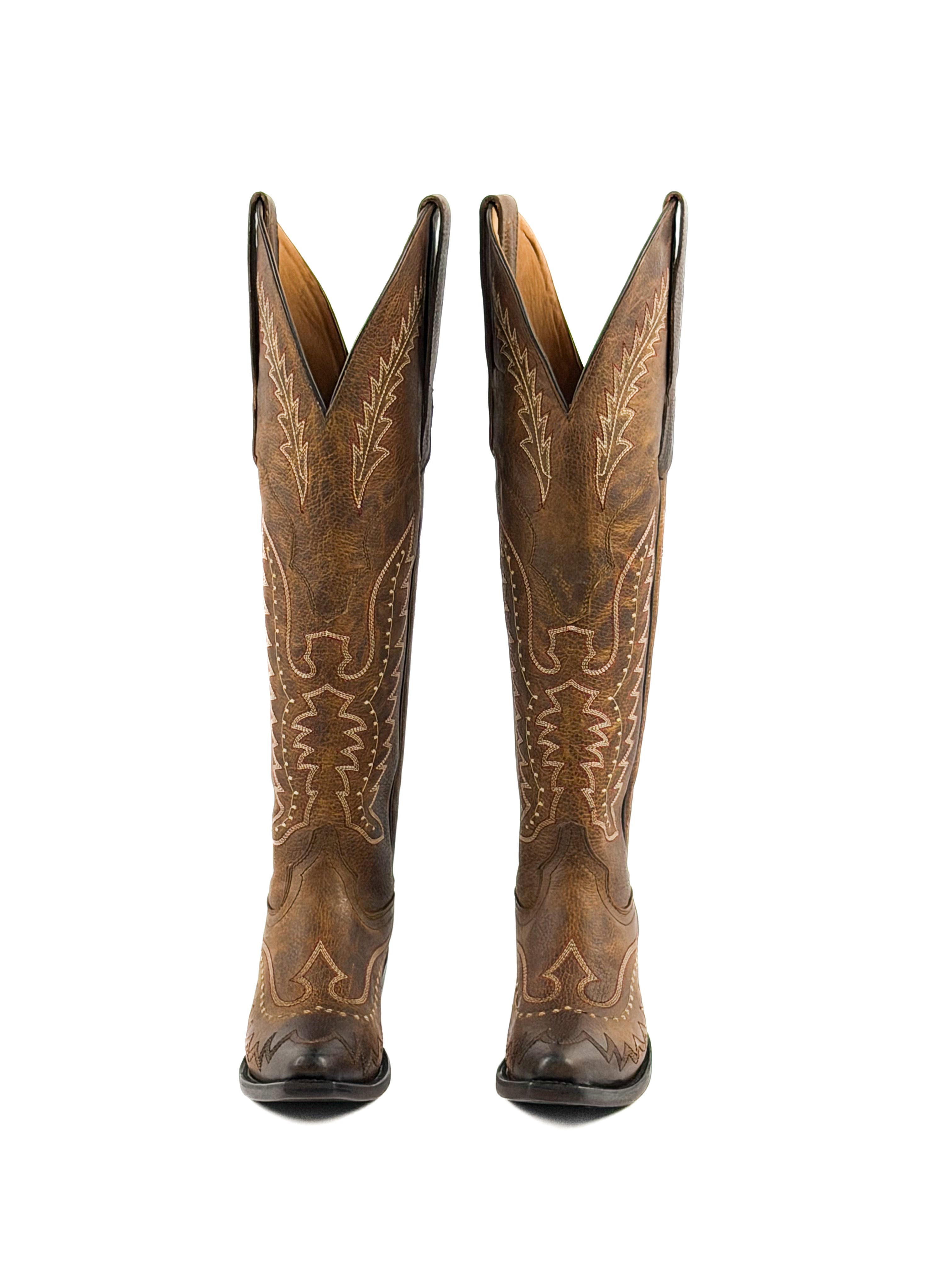 Pair of honey brown womens snip toe boots with intricate stitching  