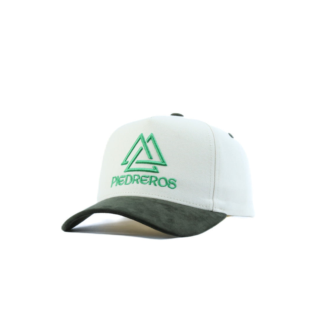 White cap with green logo and text on a white background