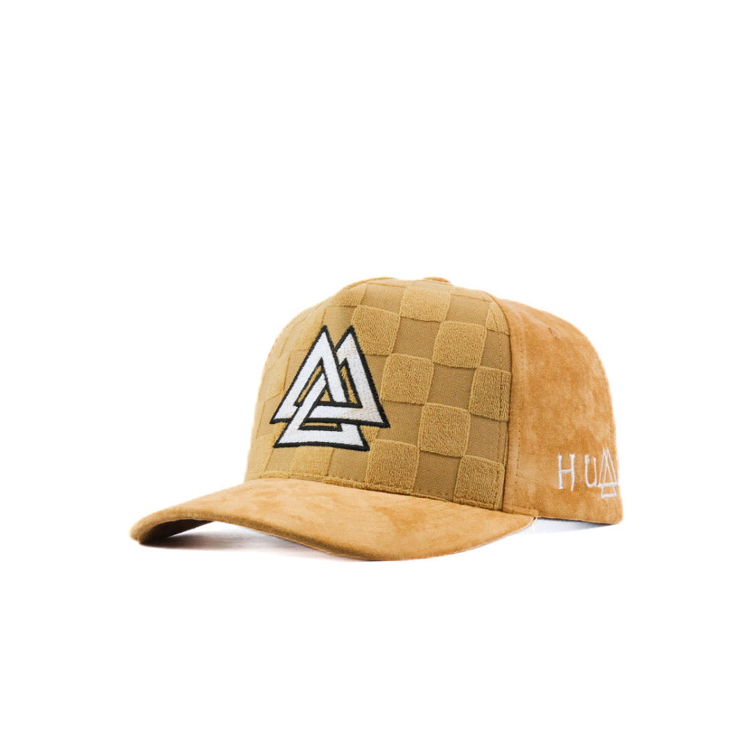 Tan cap with white and black logo