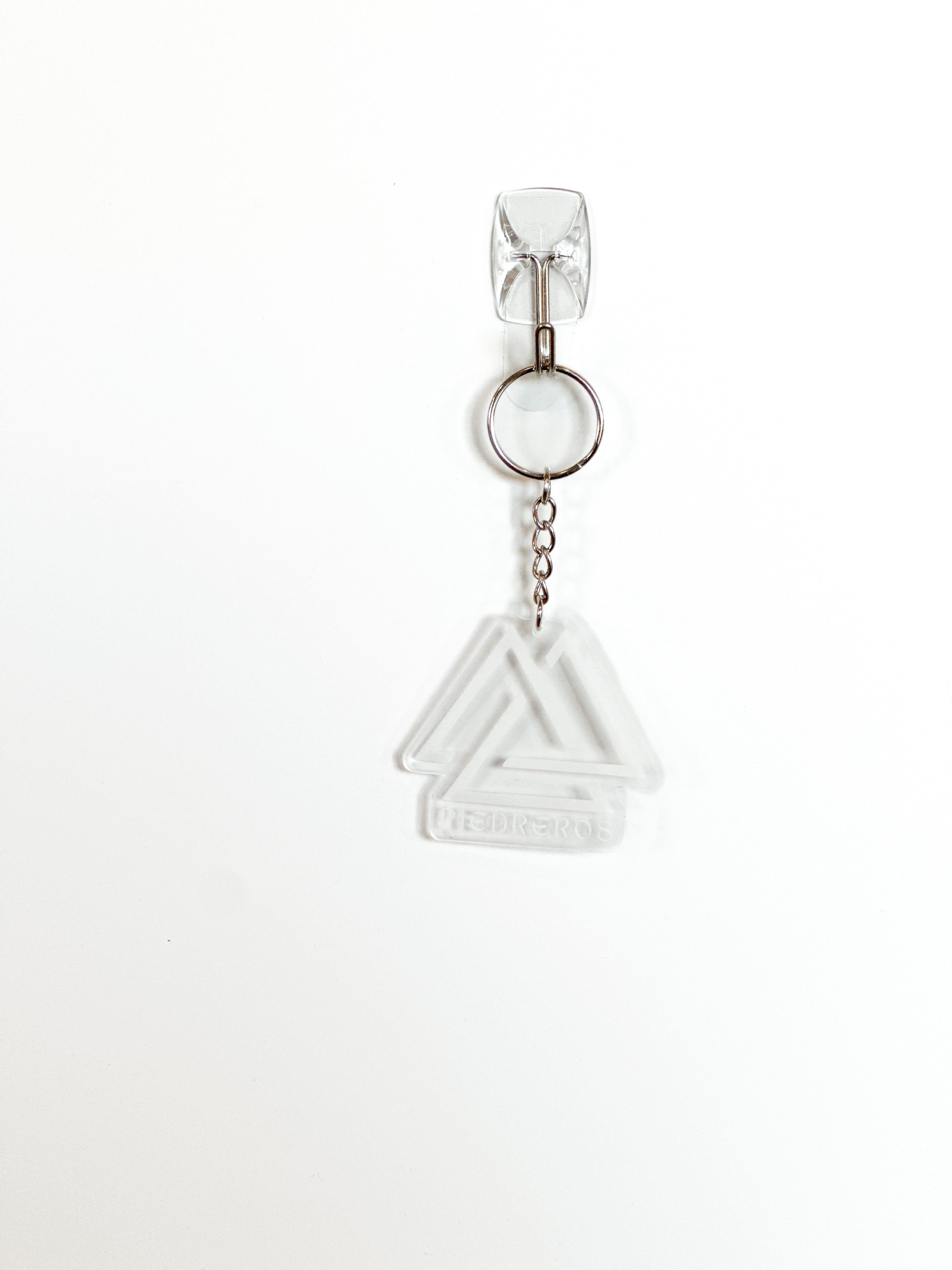 Clear plastic triangle charm on a white background