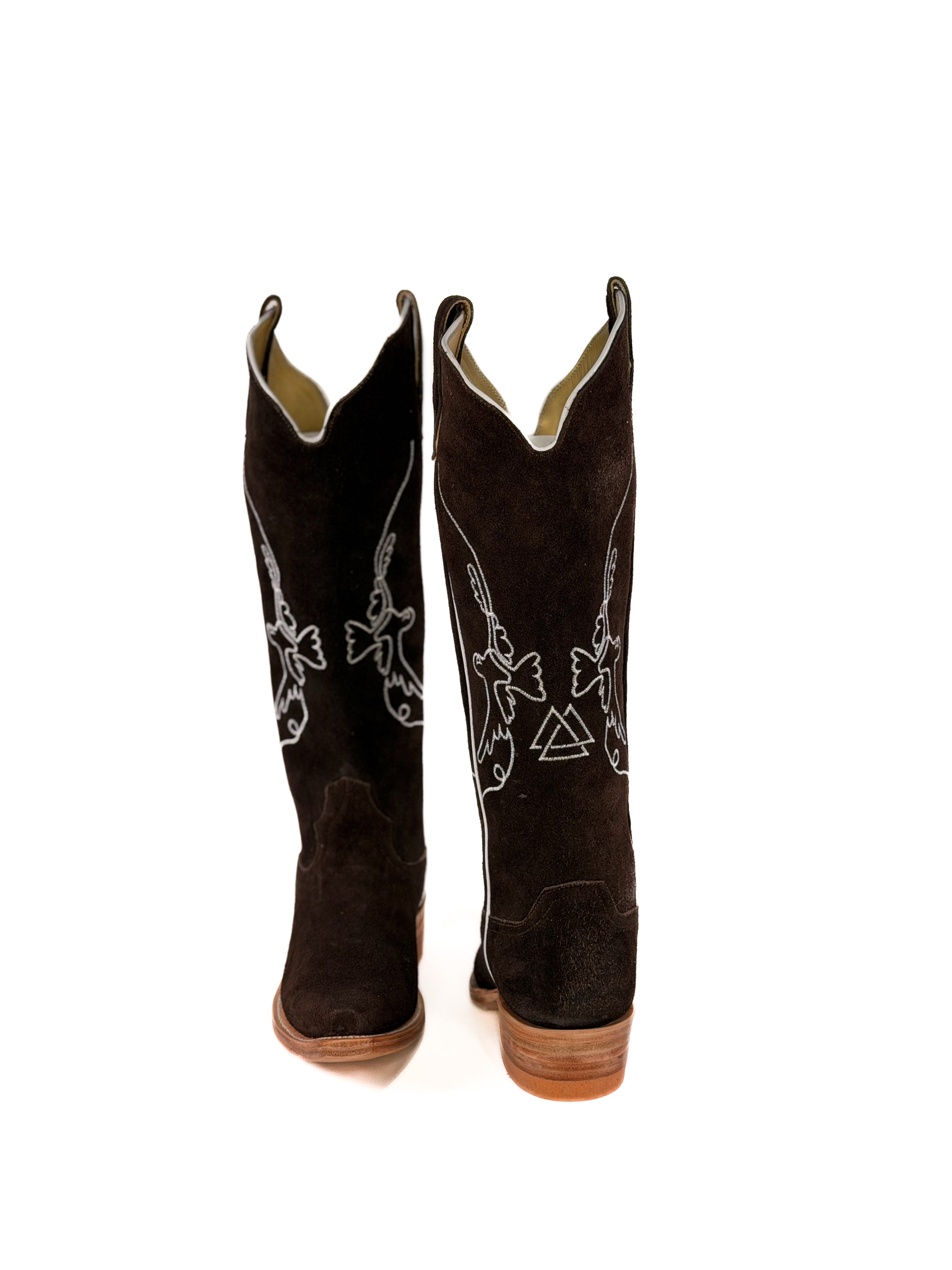 pair of brown suede cowgirl boots with white bird detailing