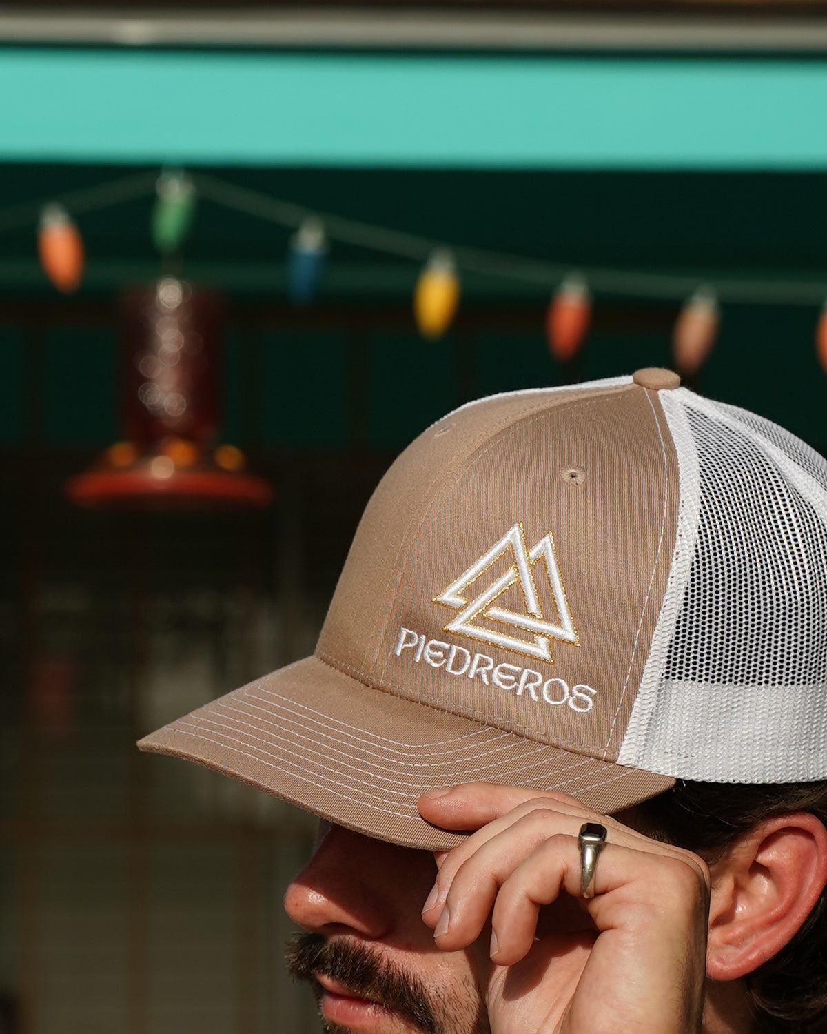 Piedreros 815 Cap Caliche — embroidered logo close-up