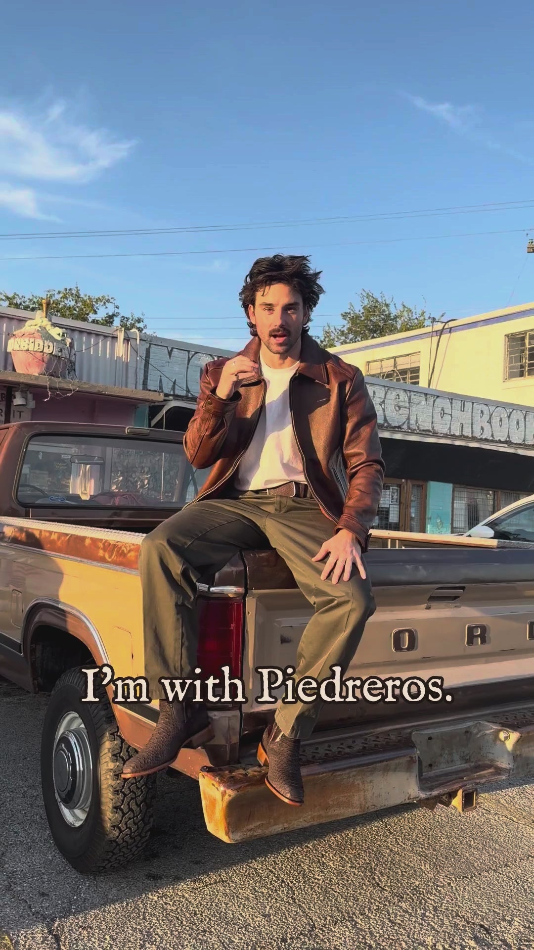 Trey wearing The Marfa brown python boots