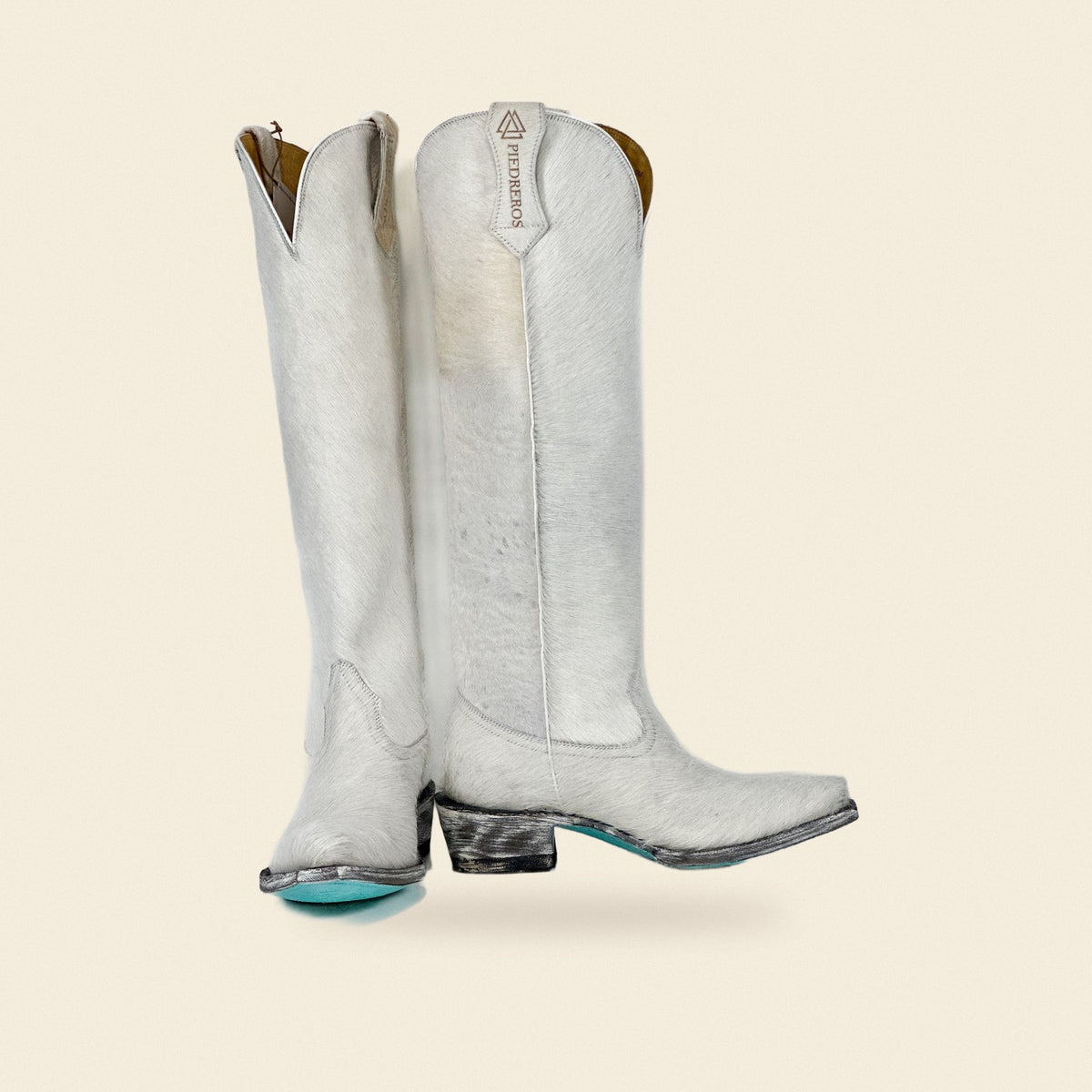 The Valeria — Cowhide Women's Cowboy Boot, front and side view